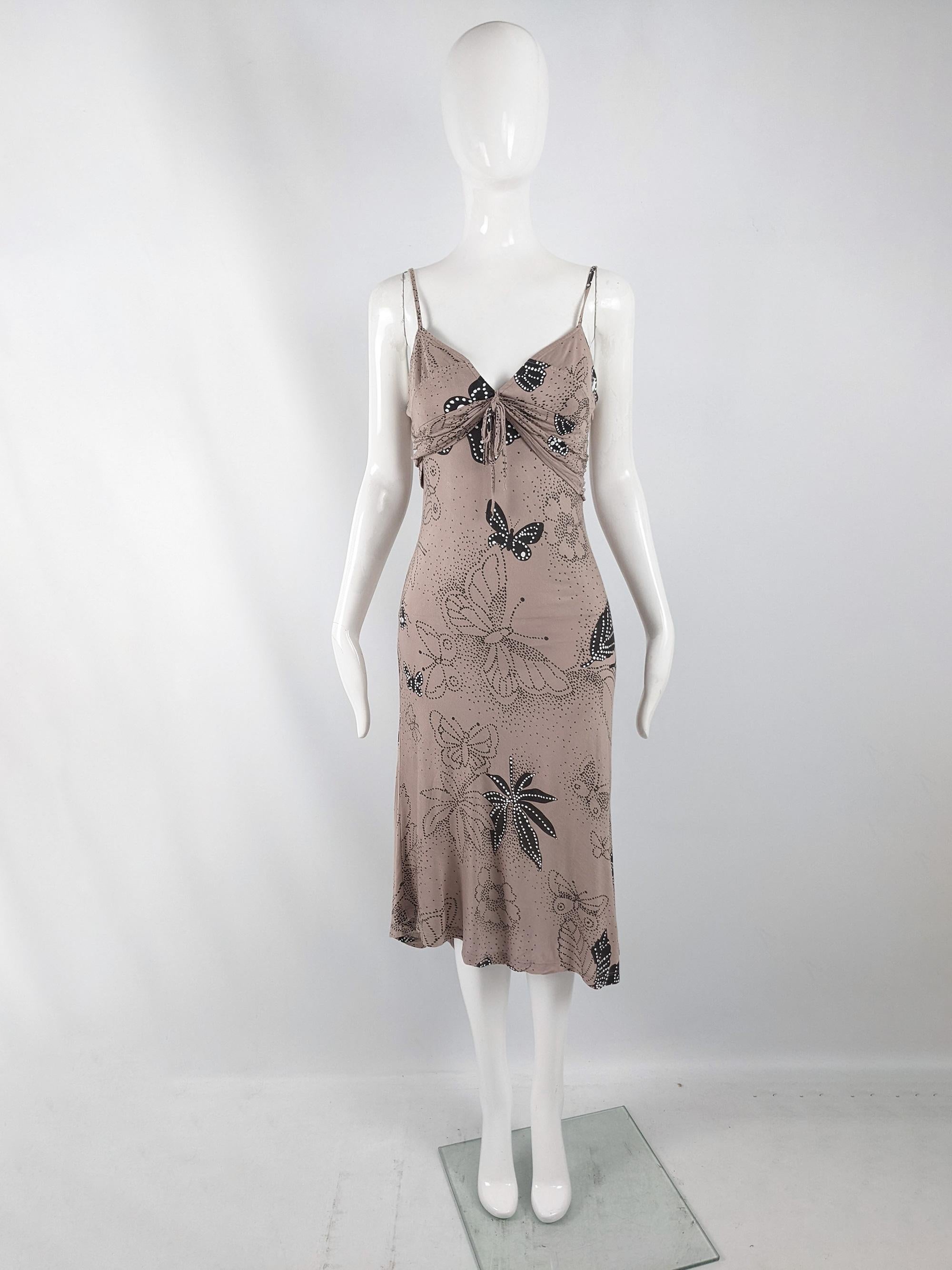 A sexy vintage womens dress from the late 90s by luxury British fashion house, Joseph. In a pinkish beige, bias cut rayon jersey fabric with a black and white floral and butterfly print throughout.

Size: Marked IT42 which equates to a UK 10/ US 6/