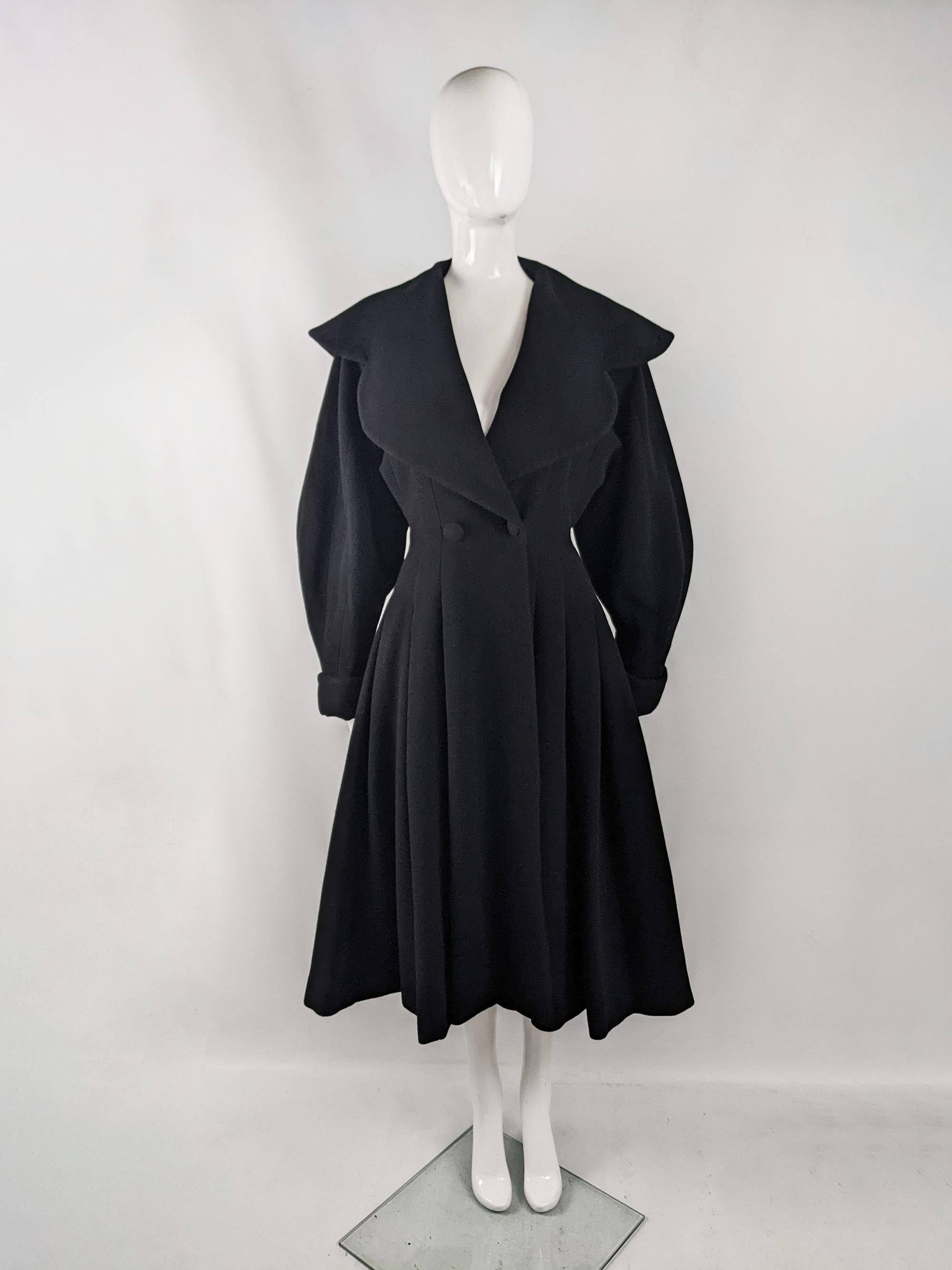 An absolutely incredible vintage womens coat from the 80s by luxury British fashion house, Joseph. Excellently constructed, made in France from a heavy black pure virgin wool fabric, which makes it perfect for autumn and winter. It has an amazing