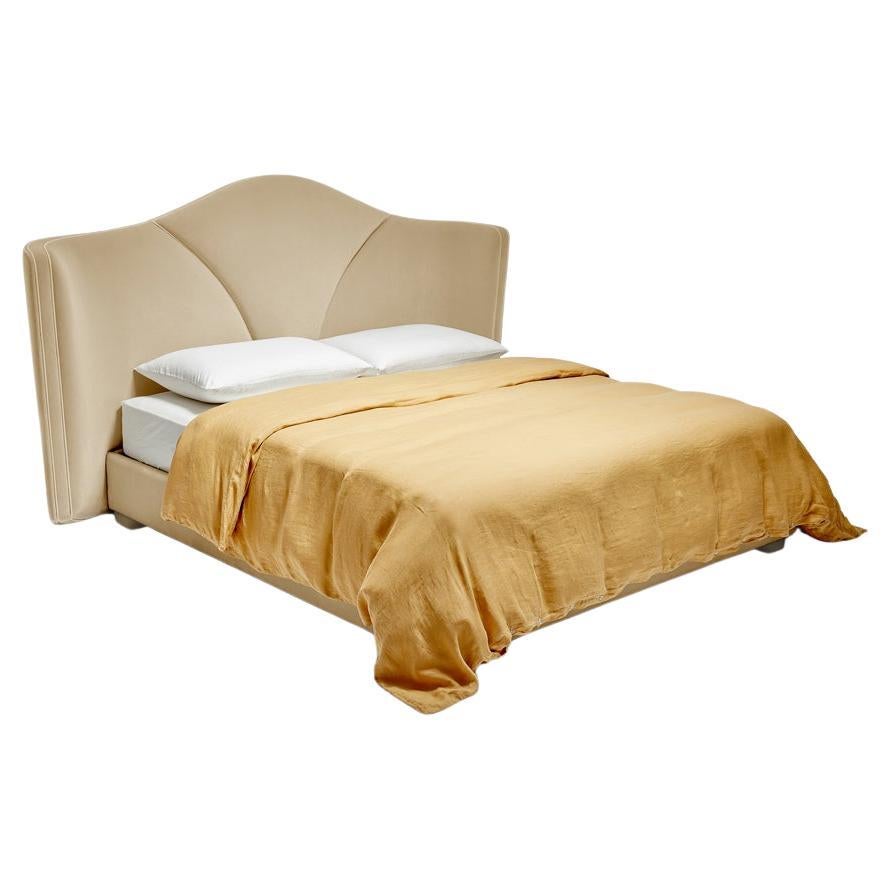 Josephine M 200 Bed by Munna
Dimensions: D 223 x W 260 x H 140 cm.
Bed Frame: D 210 x W 210 x H 33 cm.
Materials: Wood, foam, and upholstery.
Finish: Headboard Upholstery: Cotton Velvet, ref. Desert, CV 03, Headboard Pipping: Wild Silk, ref. Silver,