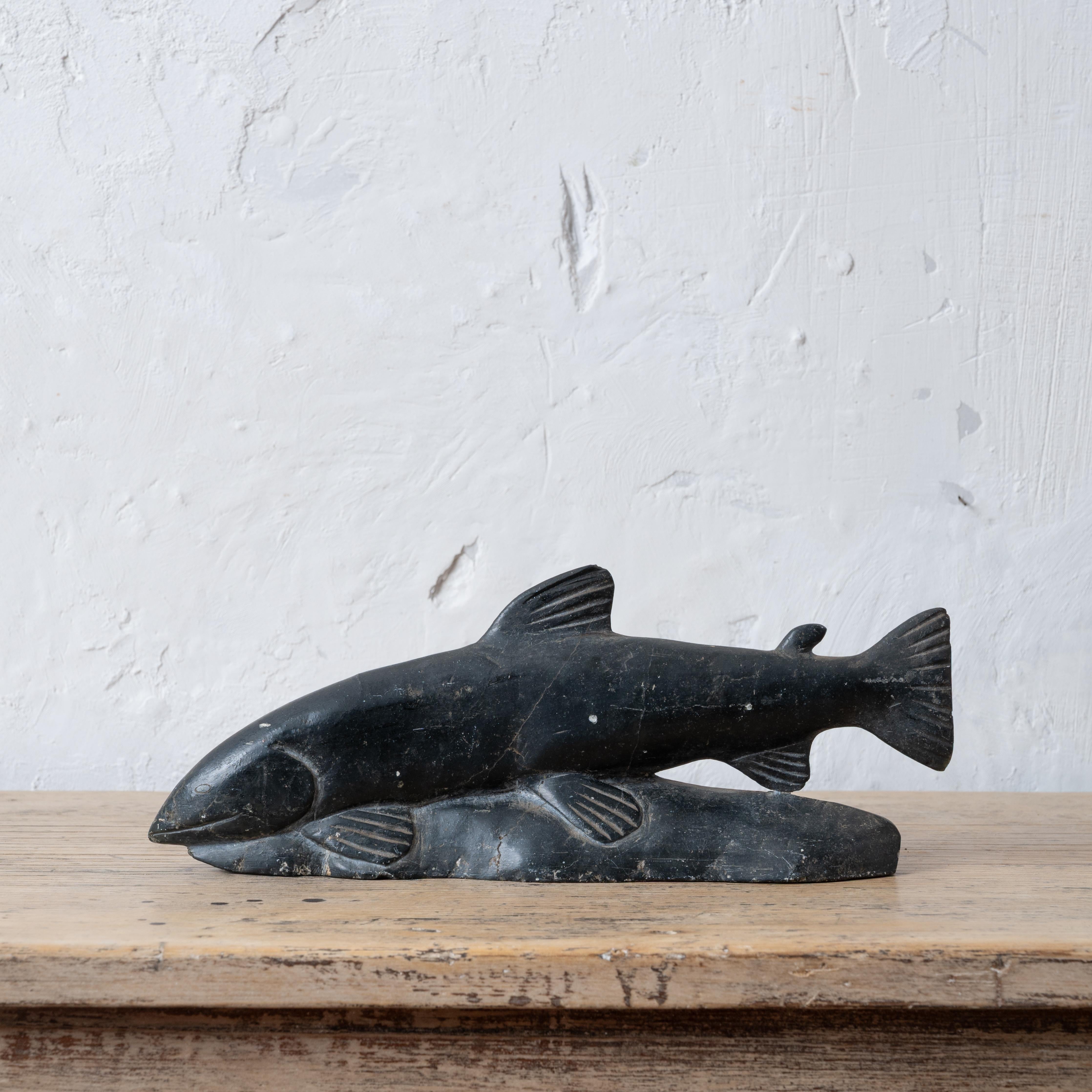 Josephine Nalukturuk 
(Inukjuak, b.1936, E9-1735)



A stone carving of a salmon, signed underside in syllabics, circa 1970.



11 ½ inches wide by 2 inches deep by 4 ½ inches tall



