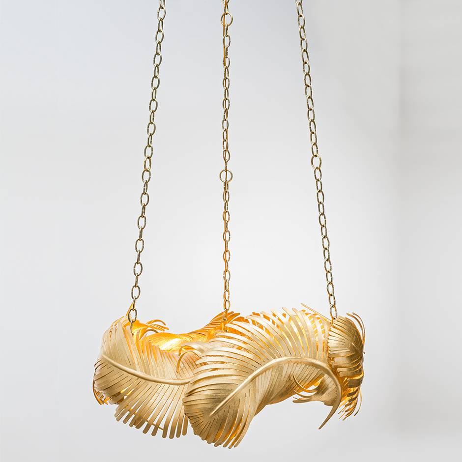 JOSSETTE CHANDELIER - Gold Leafed Feathers

The Josette Chandelier is a stunning piece of functional art that will add a touch of elegance and sophistication to any interior. It features hand-forged gold leaf over iron feathers suspended from custom