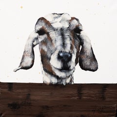 	 Brown and White Goat On Fence