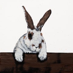 Brown and White Rabbit On Fence
