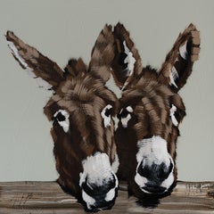 Dos burros en una valla