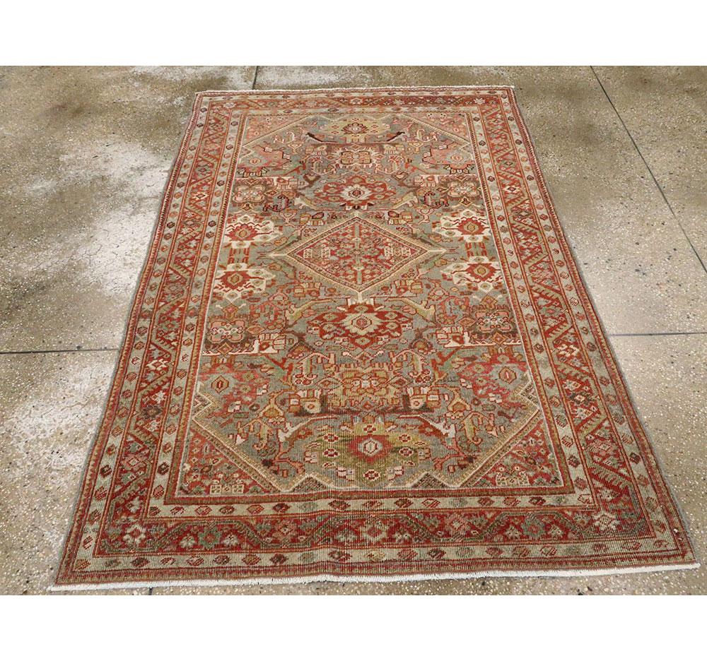 An antique Persian Mahal accent rug handmade during the early 20th century. The design is inspired and taken from the Persian Joshegan repertoire.

Measures: 4' 4