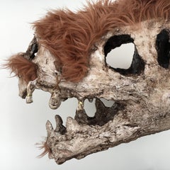Scultura a tecnica mista: 'Cranio di TRex lanoso'
