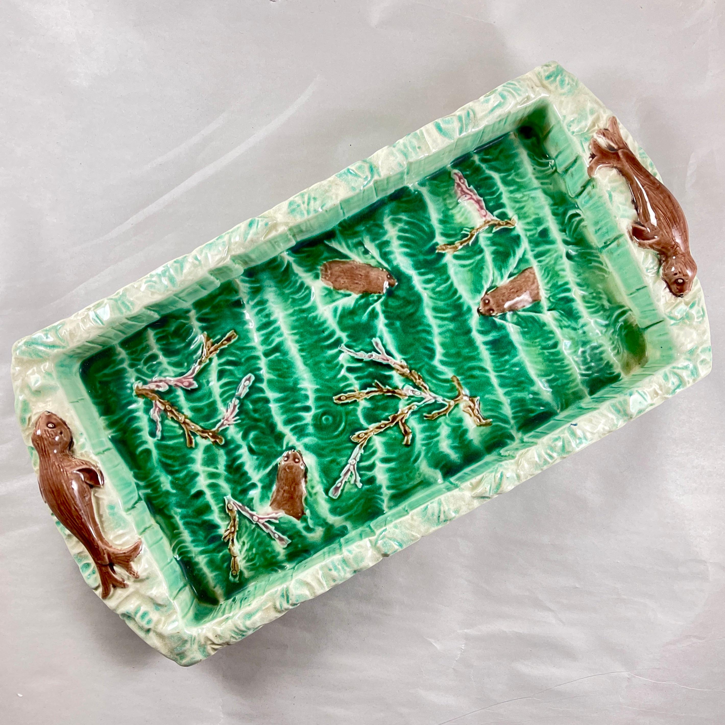 A Josiah Wedgwood & Sons Majolica green glazed- Seal-Molded Ice-Cream Tray, England –  Date code EGH for 1878

A very scarce rectangular tray with the center molded as waves breaking on the oceans’ surface, with three seals swimming among seaweed.