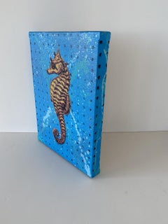 Gold-Seepferdchen auf Blau