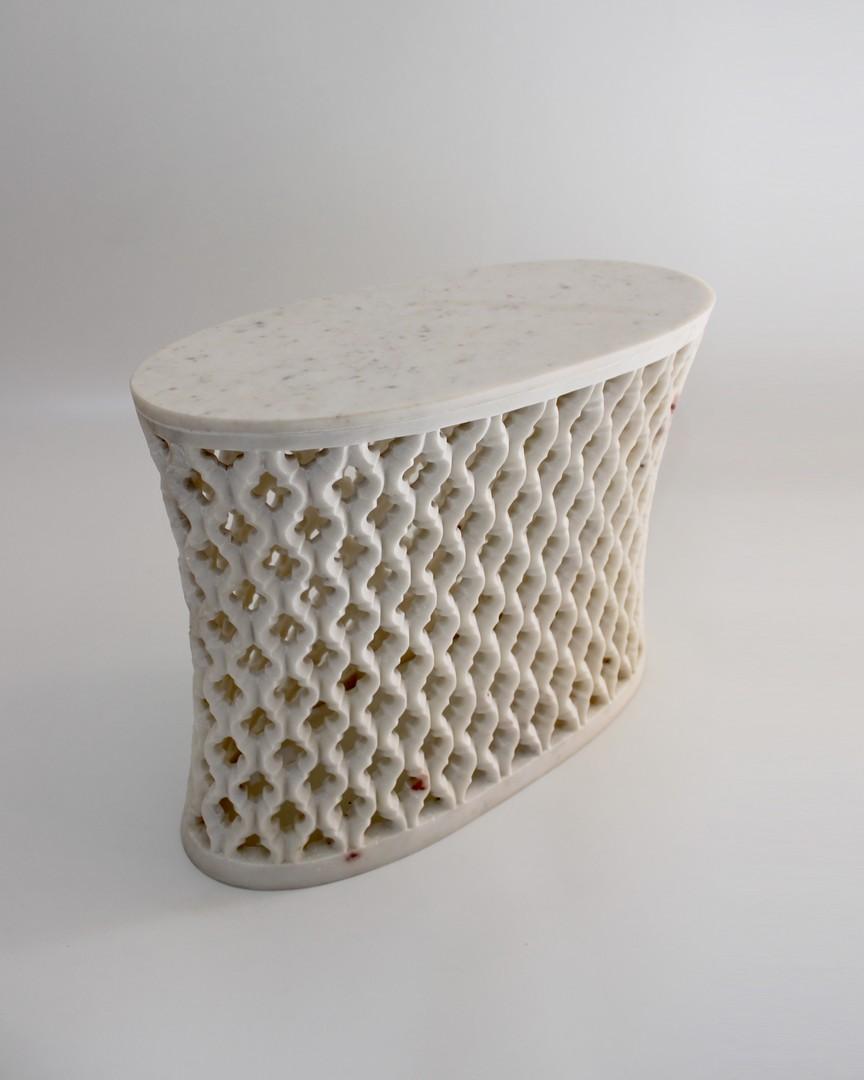 
Inspired by the elegant pierced marble “jali” screens and windows he saw in the palaces of Mughal India, the renowned designer Paul Mathieu created a unique collection of hand carved side table.
 
Solid blocks of marble are hollowed out and hand
