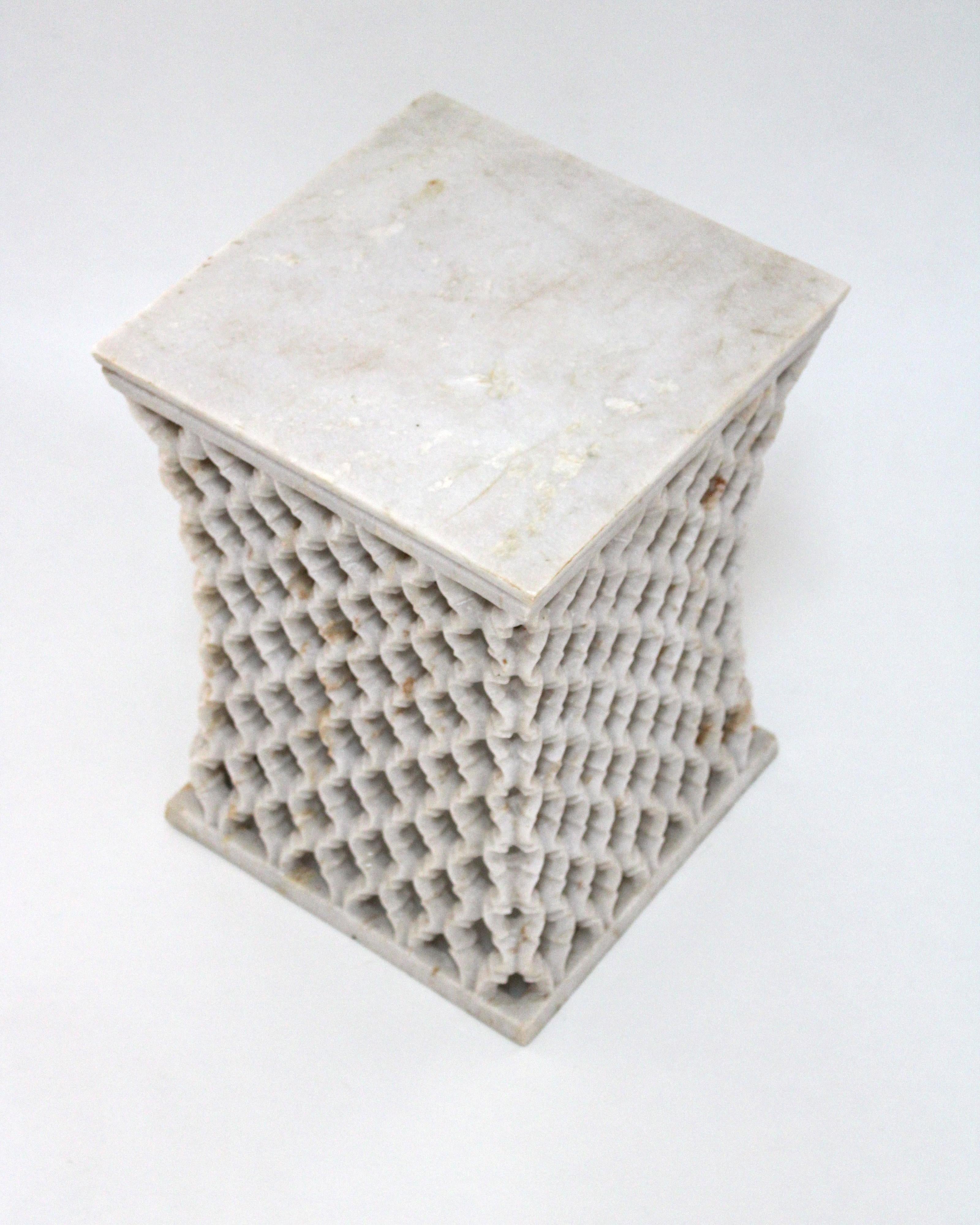 Inspired by the elegant pierced marble “jali” screens and windows he saw in the palaces of Mughal India, the renowned designer Paul Mathieu has created a unique collection of hand-carved side tables. Manufacture: Solid blocks of marble are hollowed