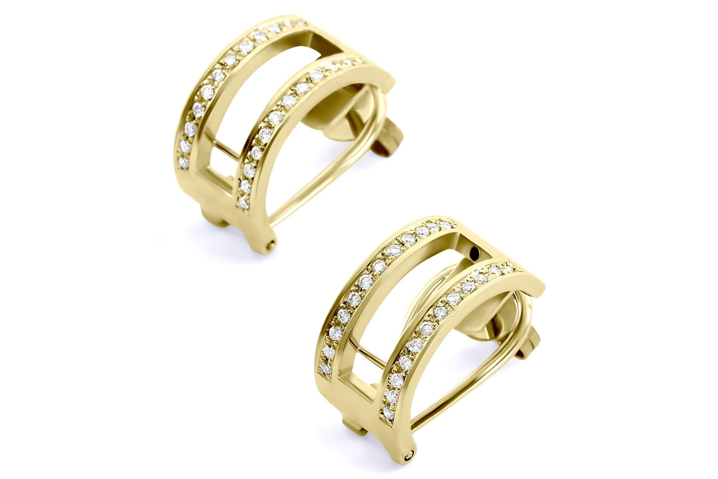 These exquisite hand crafted earrings feature two rows of the finest available brilliant cut diamonds, set in solid 18k yellow gold. Each insert boasts hand selected rubies, tsavorites and sapphires in a calibrated setting. The ingenious design