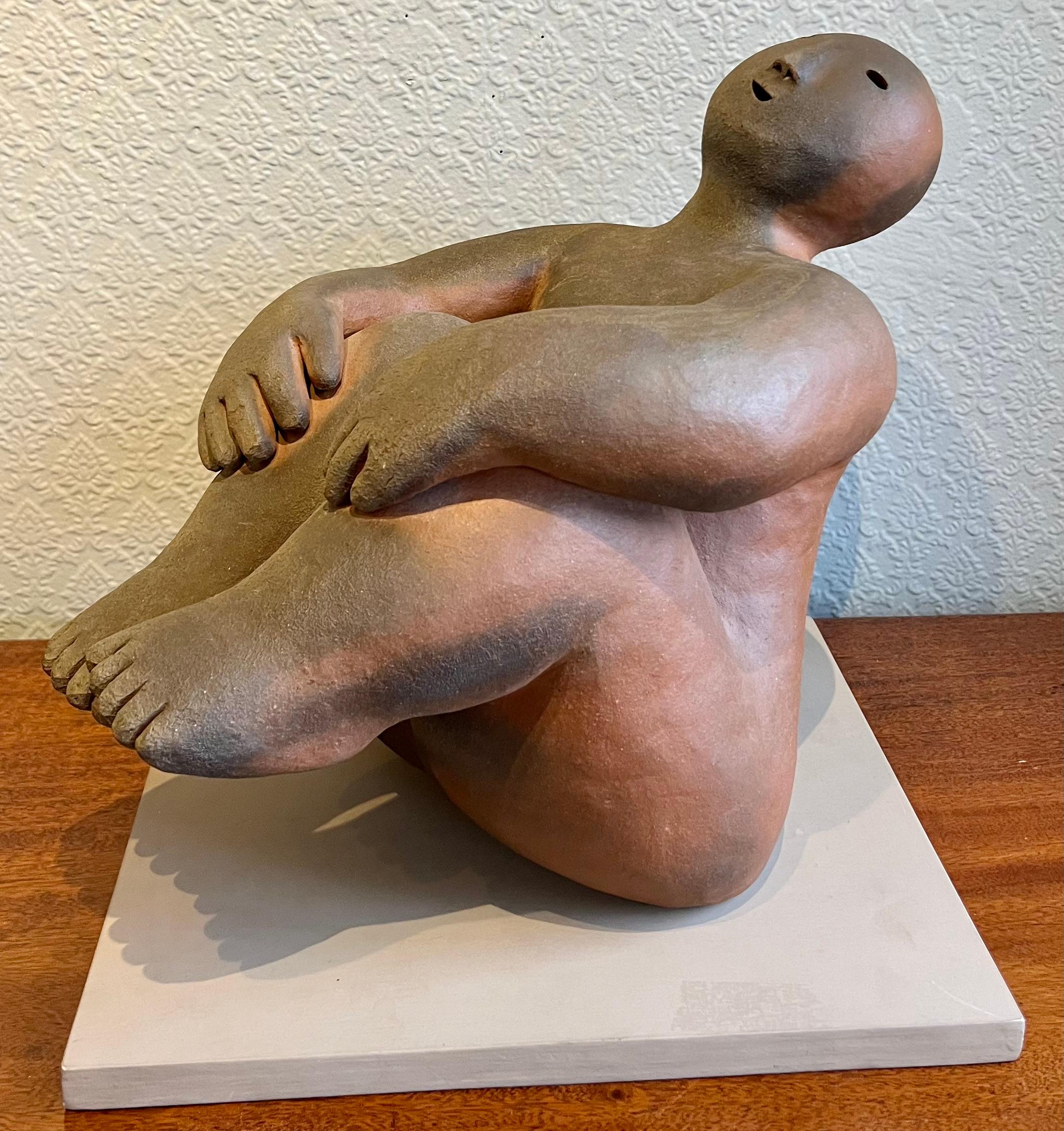 Wood fired ceramic sculpture on wooden plinth stand.  Joy Brown on her work: 