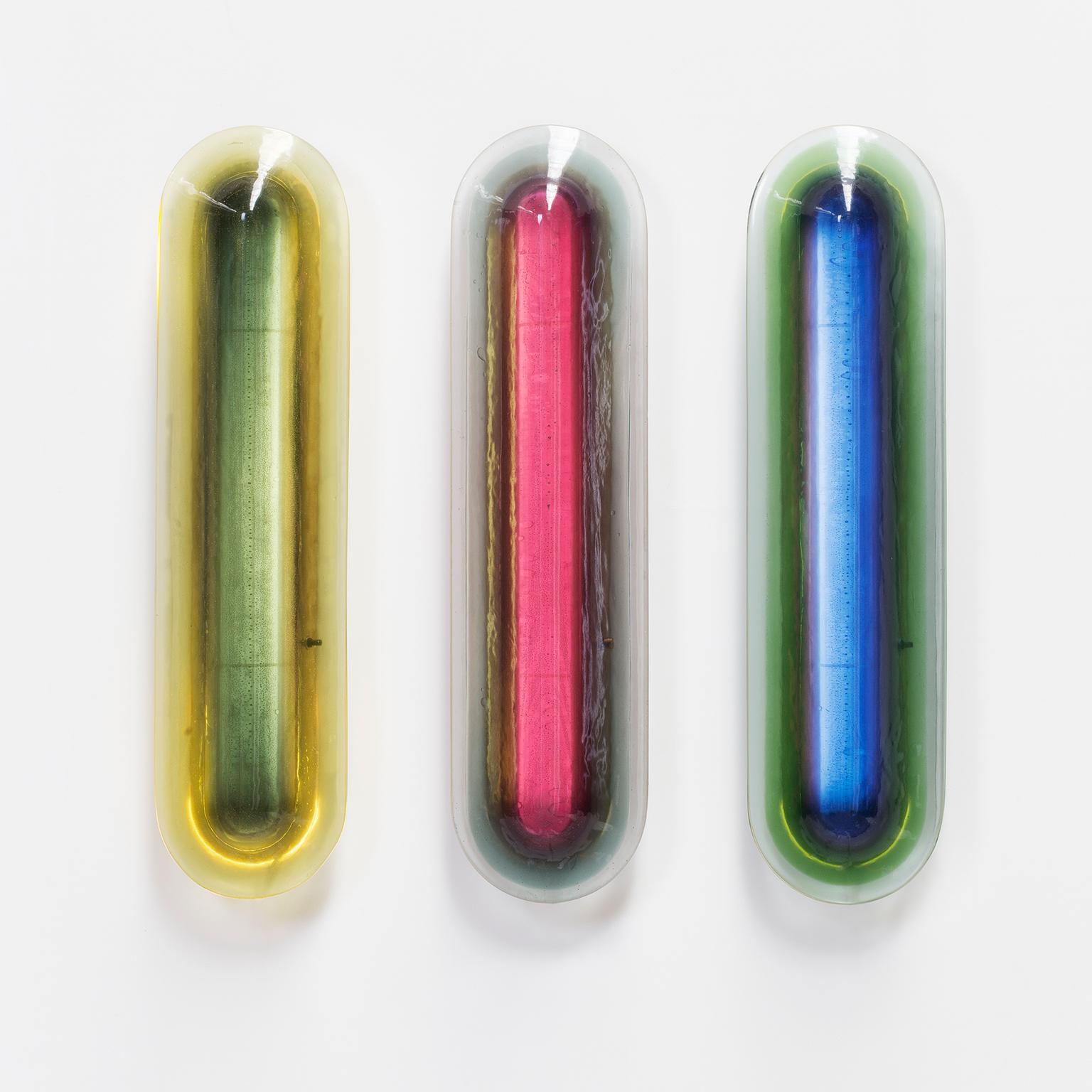 Taking cues from the 1970s and the Space Age era, these unique luminous 'capsules' draw on rich, multi-layered epoxy resin and dimmable neon lighting to produce deep and lustrous hues. By skilfully layering harmonizing tones, they emit a gentle,