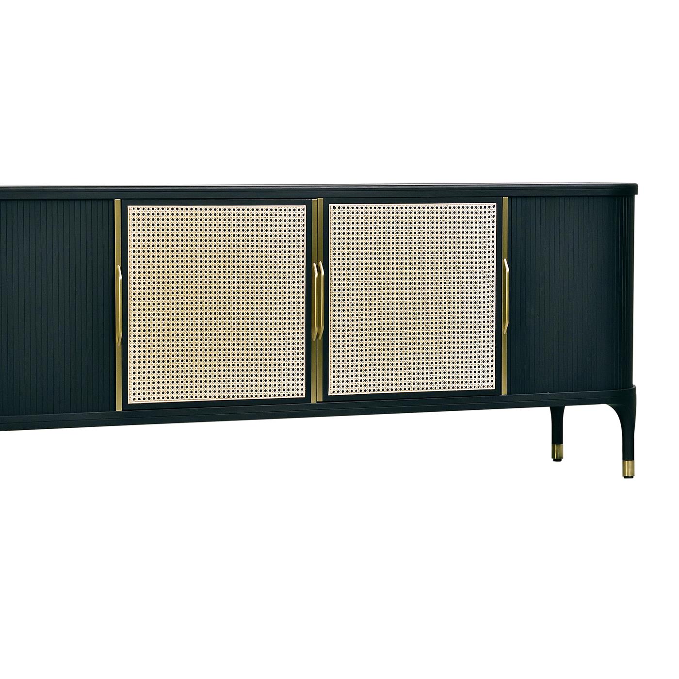 This glamorous sideboard showcases a Classic combination of materials in a captivating, modern reinterpretation. Its sophisticated ash frame is rounded at the edges and displays a timeless black finish, which suits the white Viennese cane of the
