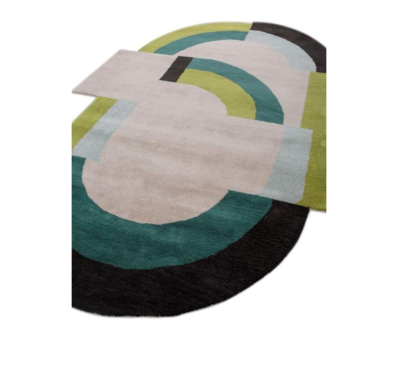 Like a canvas brought to life, our Modern Hand Tufted rug from rural India is a masterpiece of contemporary design. Imagine a vibrant interplay of shapes akin to origami creations unfolding in bold, joyful hues. This handmade rug transcends mere
