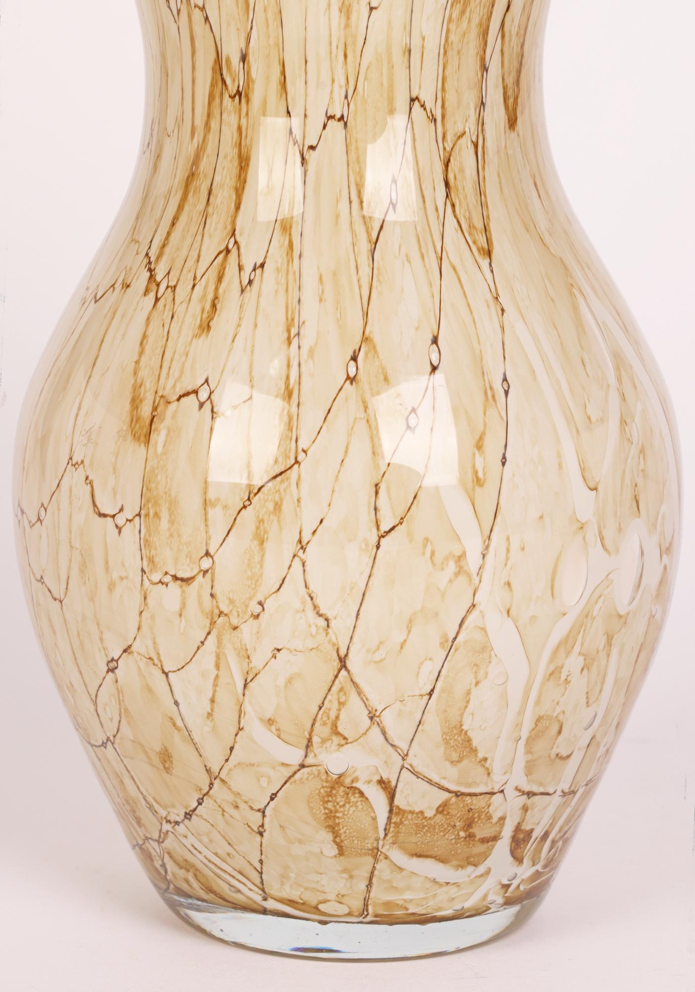 A stylish hand-blown Polish art glass vase attributed to the Jozefina Glass Makers, Krosno and dating from around 1980.

The Josefina factory was founded in Krosno, Poland in 1980 by Jozef Jankowski, a renowned artist and glass blower. The factory
