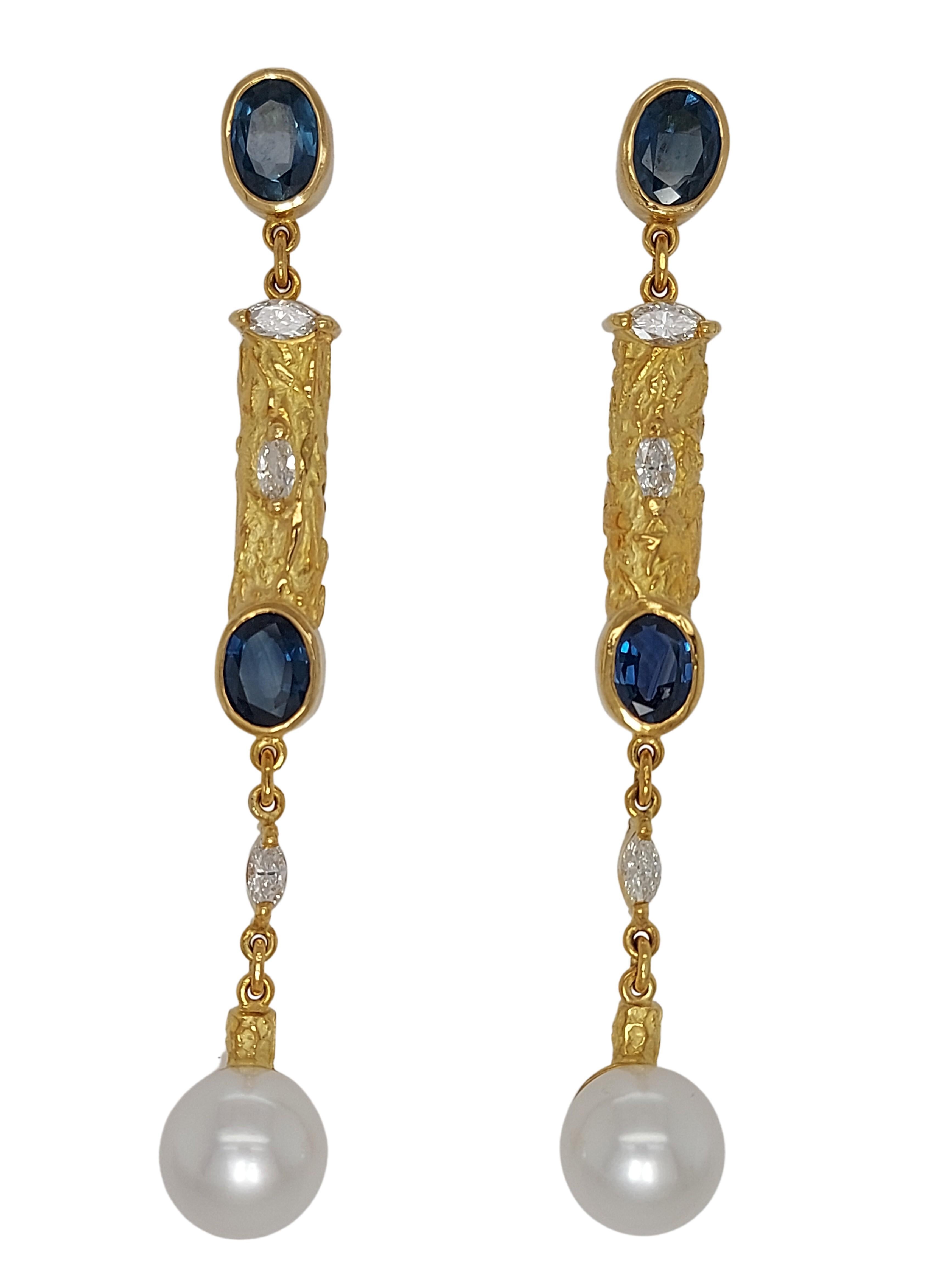Magnificant hand crafted by the artist Jean Pierre De Saedeleer 18 kt yellow gold Earrings With 5.84 Ct Sapphires, 0.79 Ct Diamonds, Pearls

One of A kind and unique hand crafted, only 1 made !

Diamonds: Marquise cut diamonds (together approx.