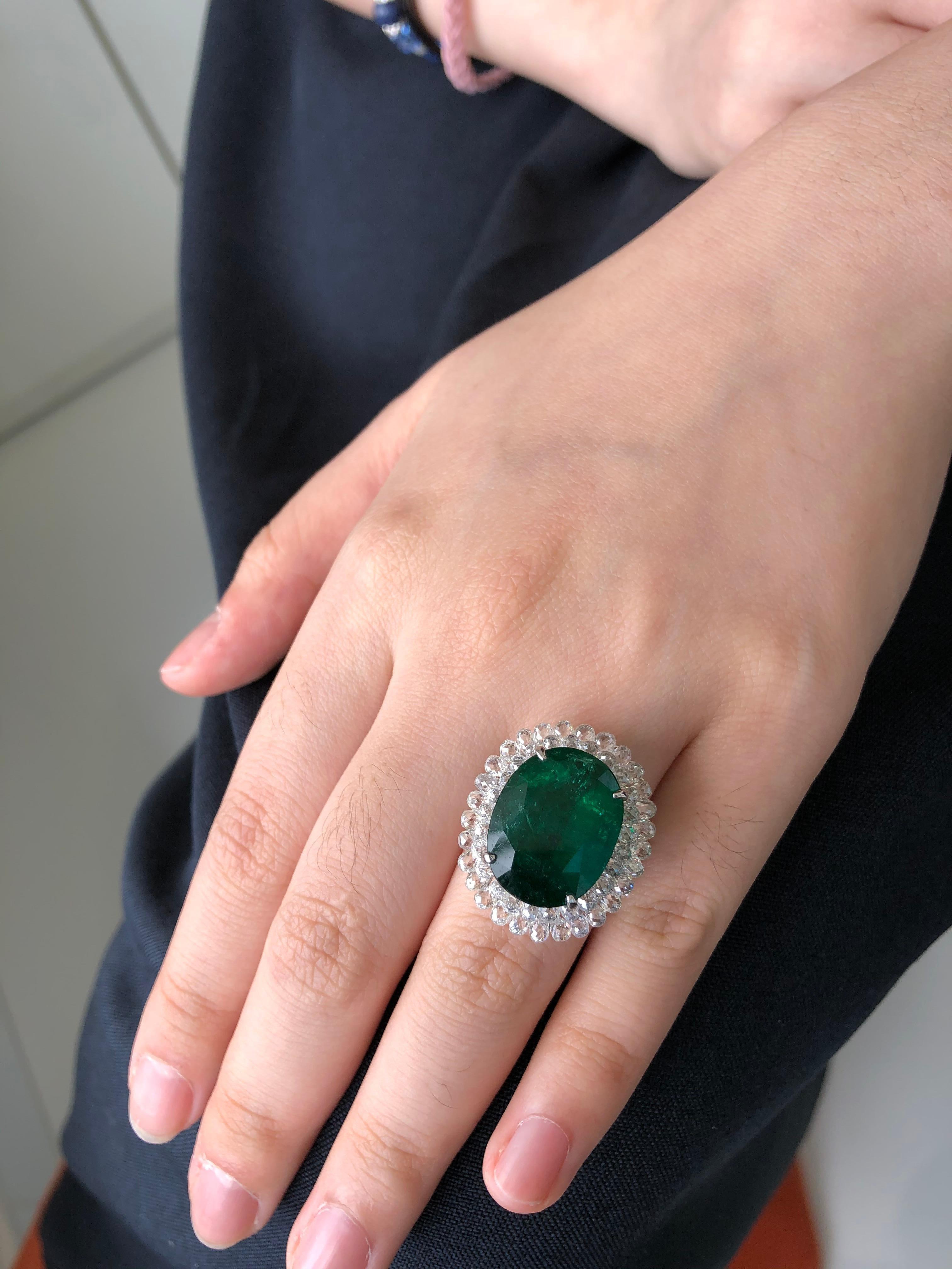 JR 18 Karat White Gold Invisible Diamond Briolette Emerald Ring

Classic combination of Emerald and white Ring Featuring 14.12 carats Oval Shape Zambian Emerald as the center piece and studded with 6.79 carats Invisible Setting of White Diamond