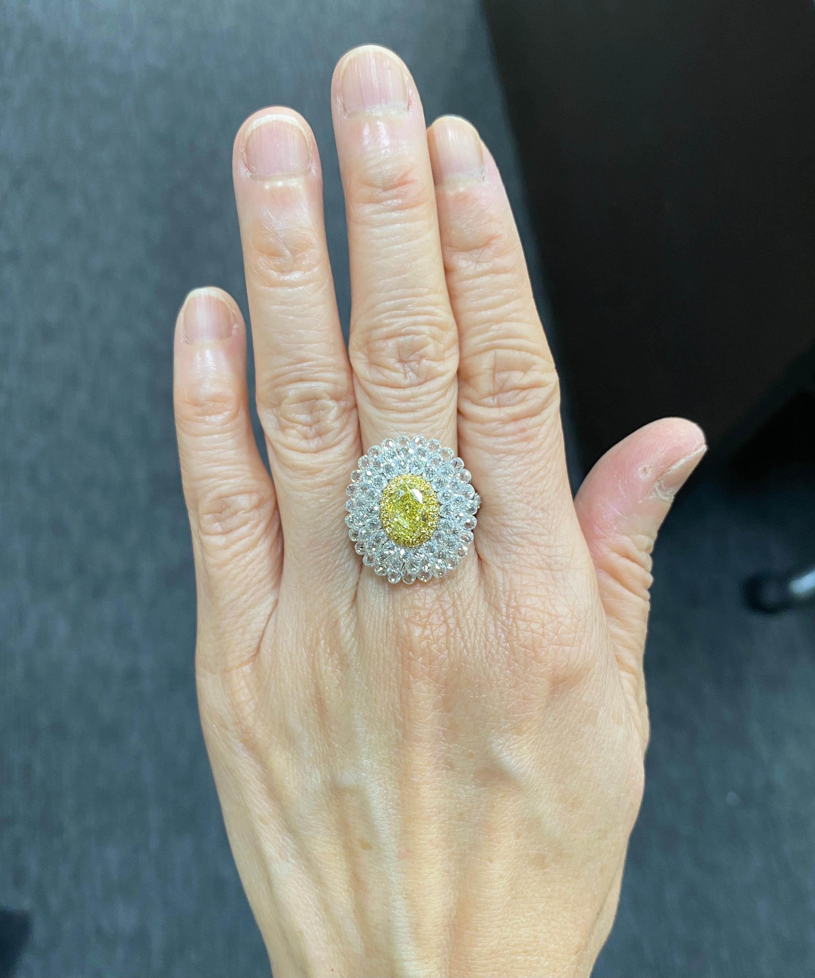 JR Invisible Diamond Briolette & Yellow Diamond Ring

Classic combination of Yellow diamond and white Briolette Ring Featuring 1.77ct Fancy Yellow / VS  Oval Shape as the center piece and studded with 7.97 carats Invisible Setting of White Diamond