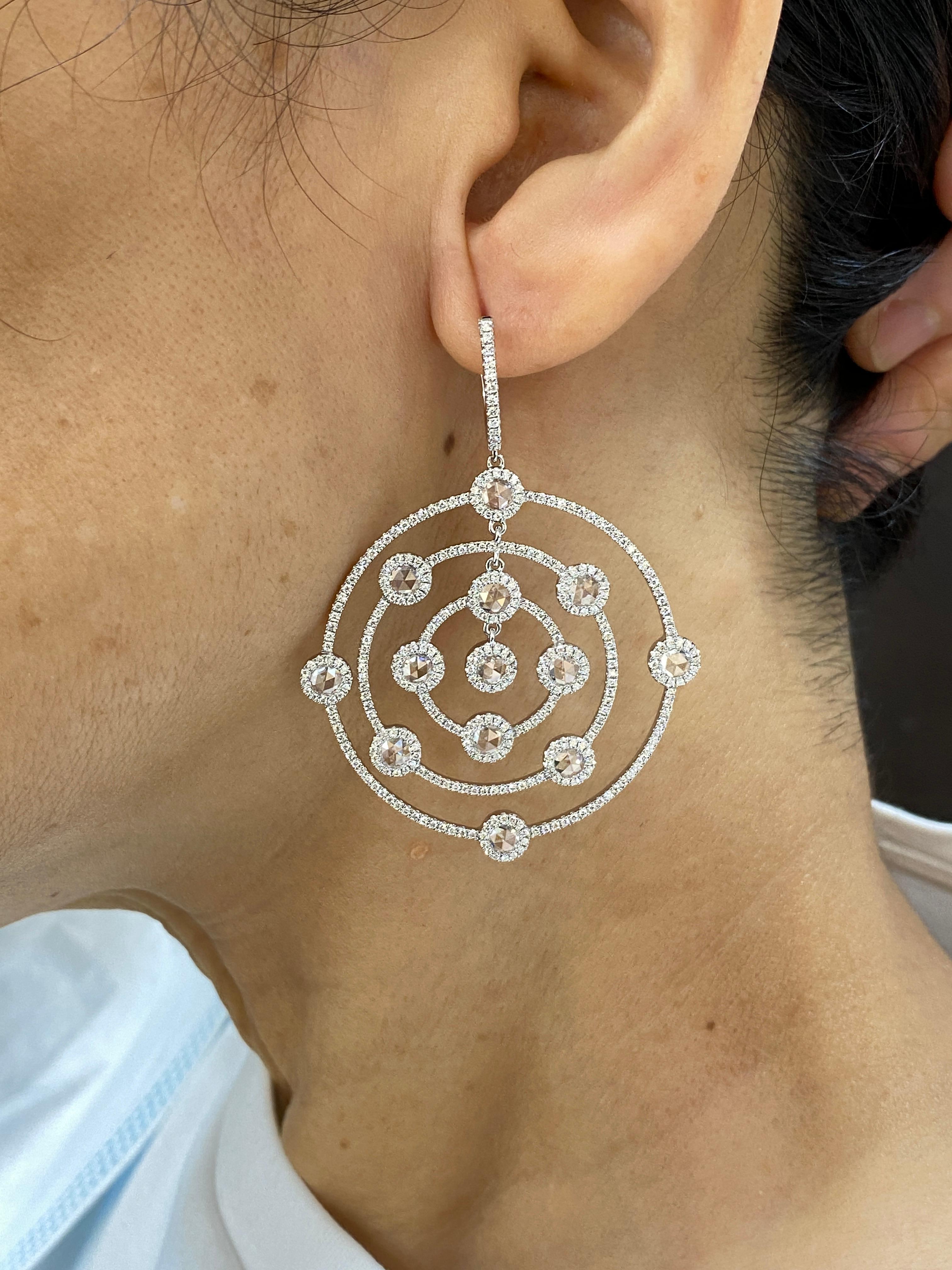 JR Rose Cut Dangling 18 Karat White Gold Earring

Chic, timeless and luxurious - find all these 3 words at once in these shimmering pair of Rose cut diamond earrings. They are purely authentic designed, crafted with glittery diamonds.

Diamond