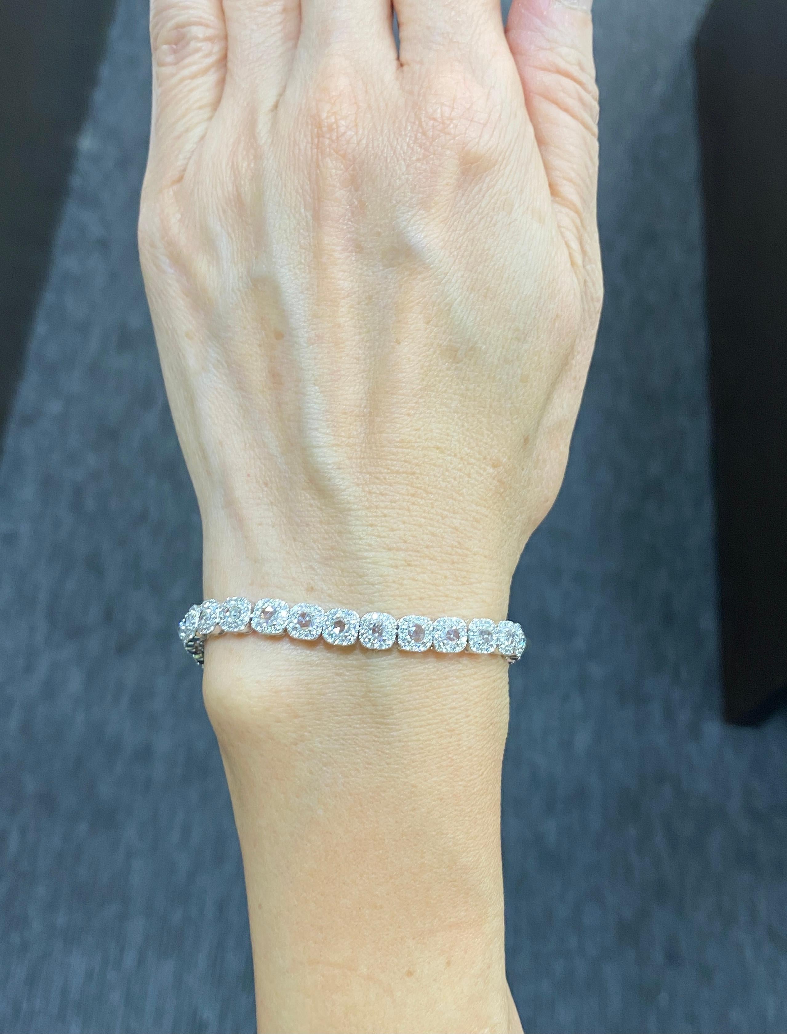 JR Rose Cut & Round Diamond 18 Karat White Gold Tennis Bracelet   

Embodying unique style and elegance, this fine jewelry piece is simply striking.
With round rose-cut diamonds encircled in a precise cushion-shaped ring of our micro-pave accents,