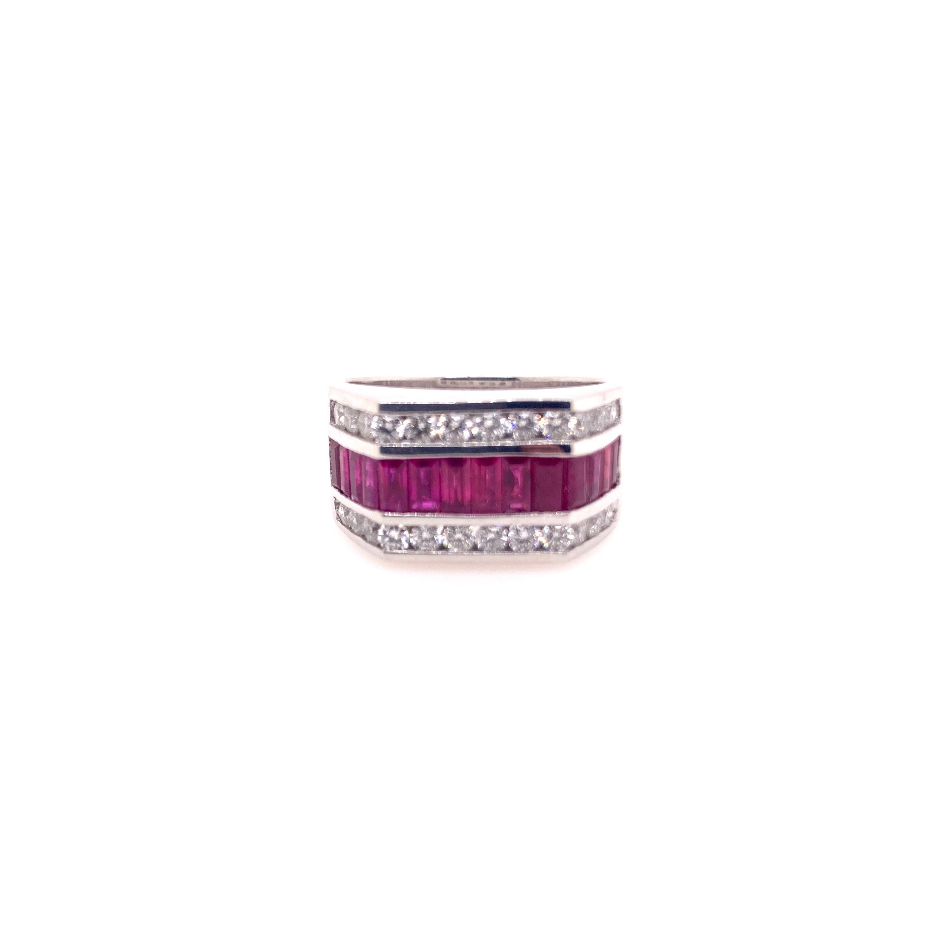 One of our best sellers, this J.Ray style band is easy to wear formally as well as casually.  The ruby baguettes are channeled set along with the round brilliant diamonds on both sides of the rubies.  The sharp angles give it a clean, contemporary