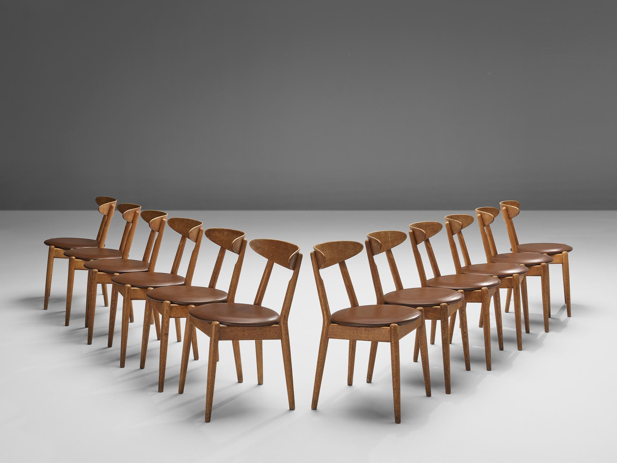 Jørgen Bo and Vilhelm Wohlert for P. Jeppesens Møbelfabrik, set of twelve ‘Louisiana’ dining chairs, oak, leather, Denmark, 1958.

The ‘Louisiana’ chair was initially created for the Louisiana Museum of Modern Art in Humlebæk (Denmark) which Danish