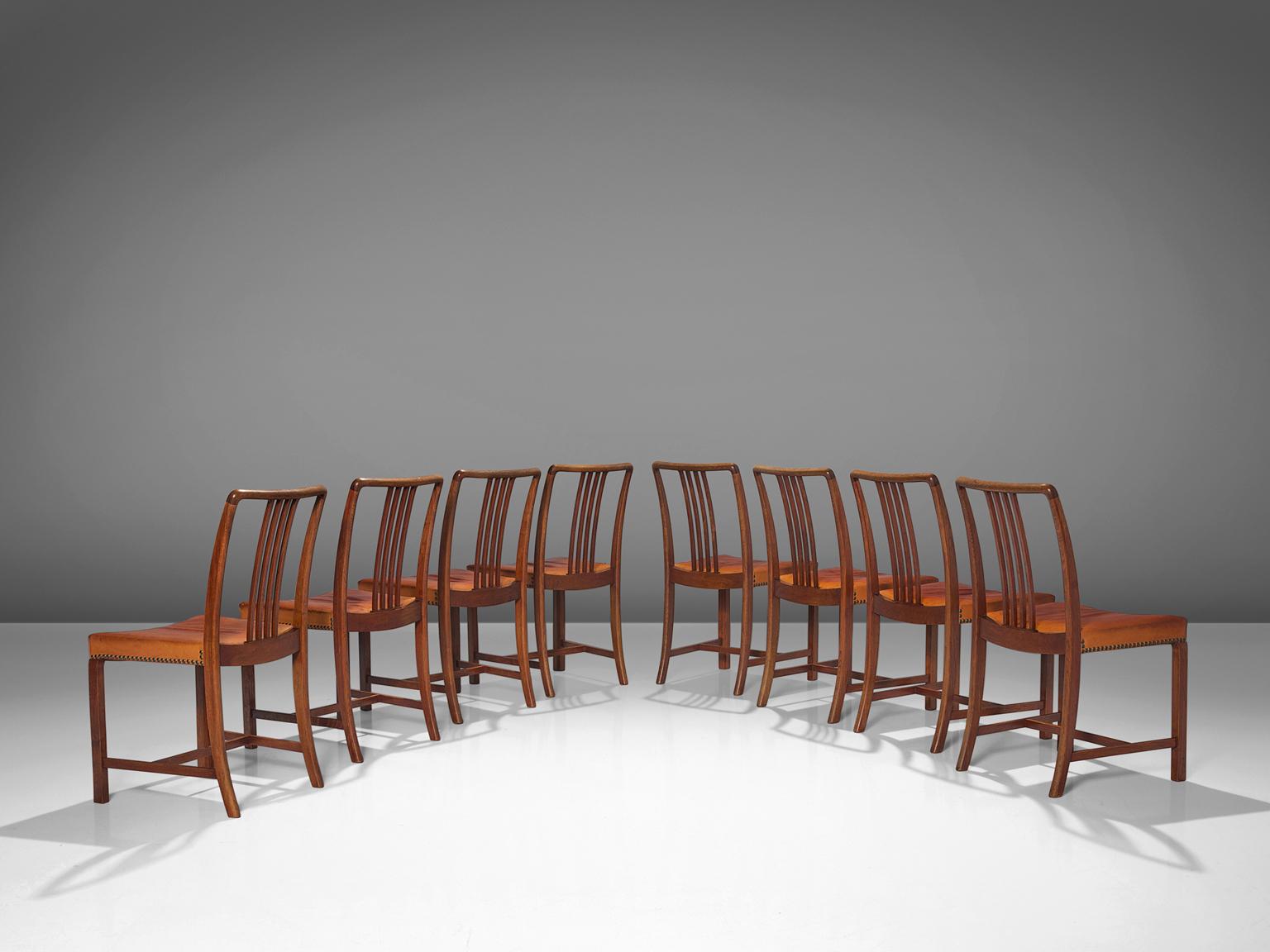 Jørgen Christensen, set of eight dining chairs, leather, oak, brass, Denmark, 1950s 

Exclusive set of eight dining chairs designed by Danish designer and cabinetmaker Jørgen Christensen. The seats are upholstered with patinated natural leather and