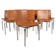 Juego de ocho sillas de comedor Jørgen Høj, piel tostada y acero inoxidable