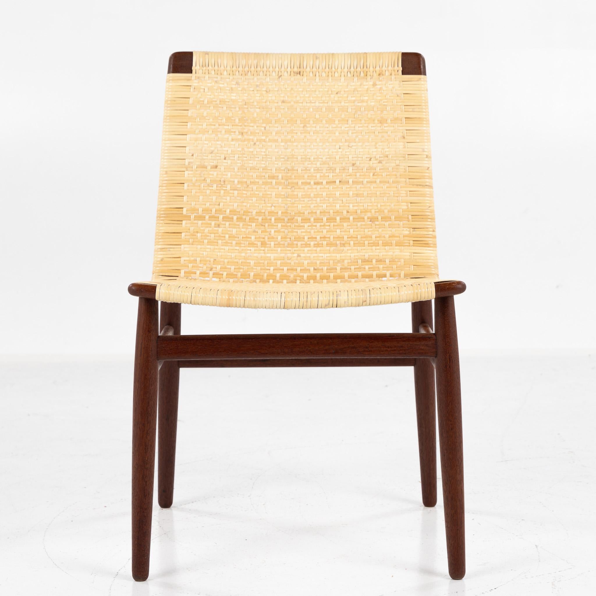 Set of eight rare dining chairs in solid teak with seat and back in new cane. Designed in 1951 by architect Jørgen Høj.
