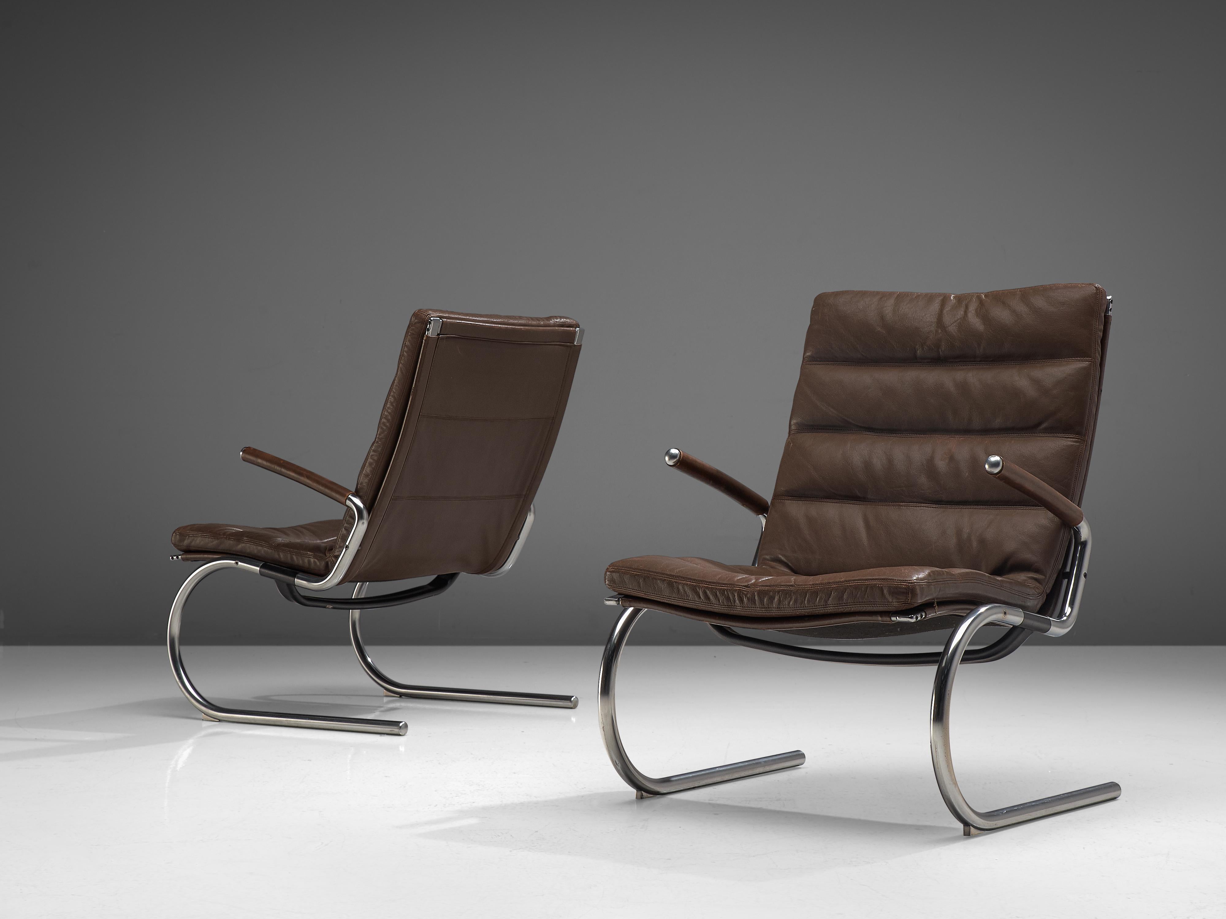Jørgen Kastholm, pair of lounge chairs, metal and leather, Denmark, 1960s.

This modern pair of armchairs is designed by Jørgen Kastholm in the 1960s. They are executed in tubular steel and leather with an L-shaped seating. The legs and armrests