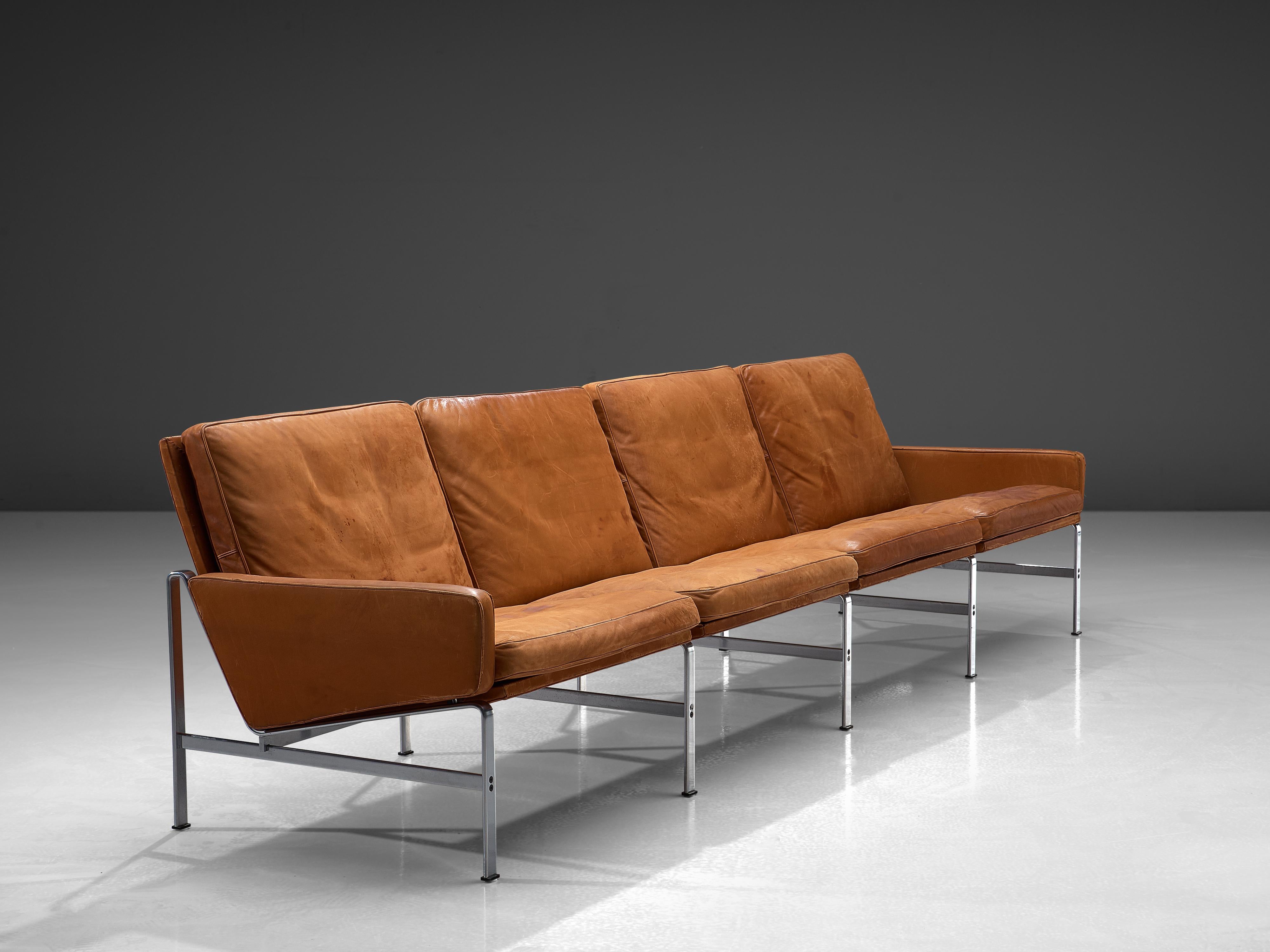 Jørgen Kastholm & Preben Fabricius for Kill International, four-seat sofa, leather, steel, Denmark, 1960s.

Large sofa in patinated cognac leather by Fabricius and Kastholm. The base of this sofa gives a characteristic and open character.