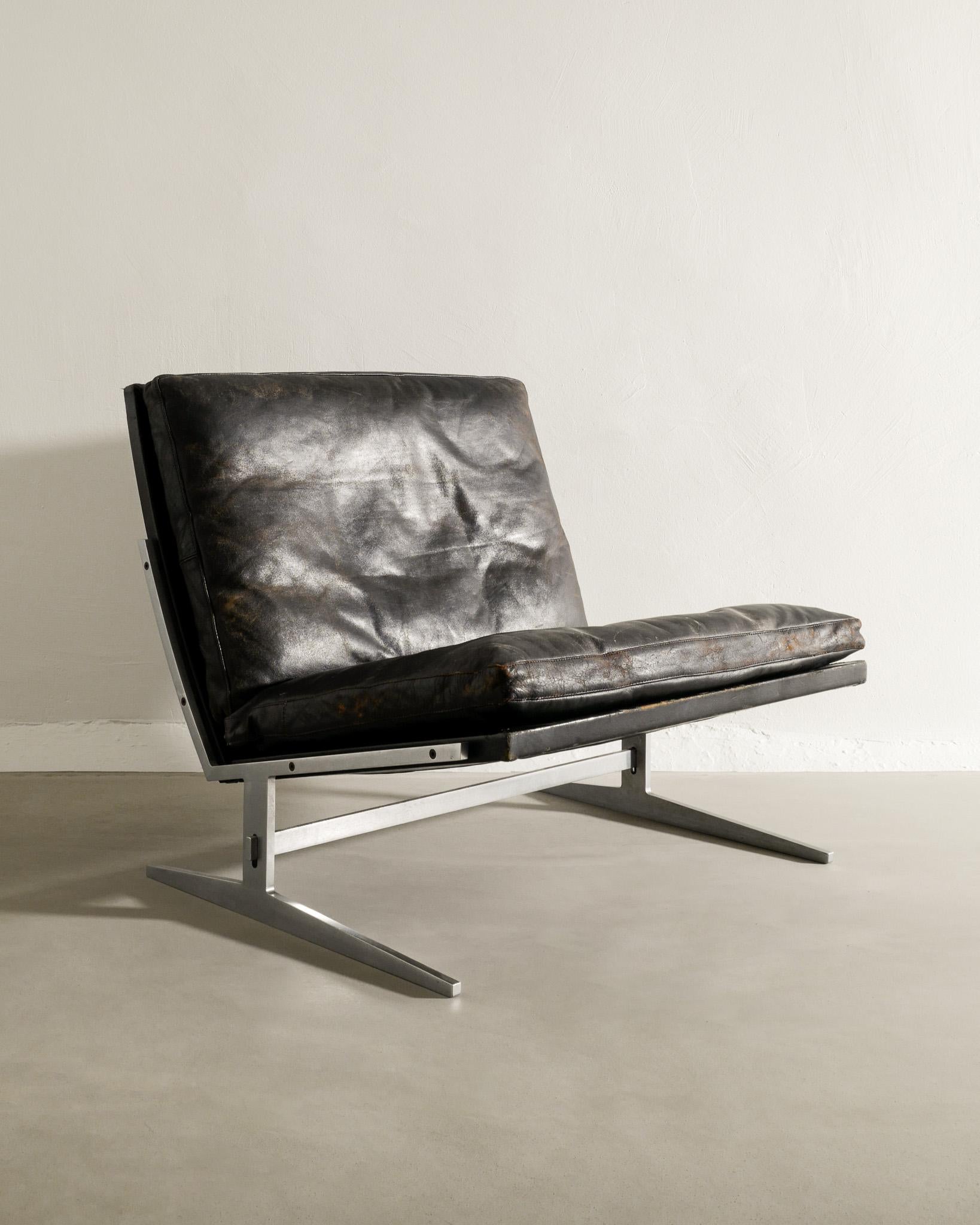 Rare Scandinavian mid century arm / easy chair in steel and original black leather by Jørgen Kastholm & Prefen Fabricius produced by Bo-Ex Denmark, 1960s. Original condition with patina from age and use. The leather is worn but not damaged.