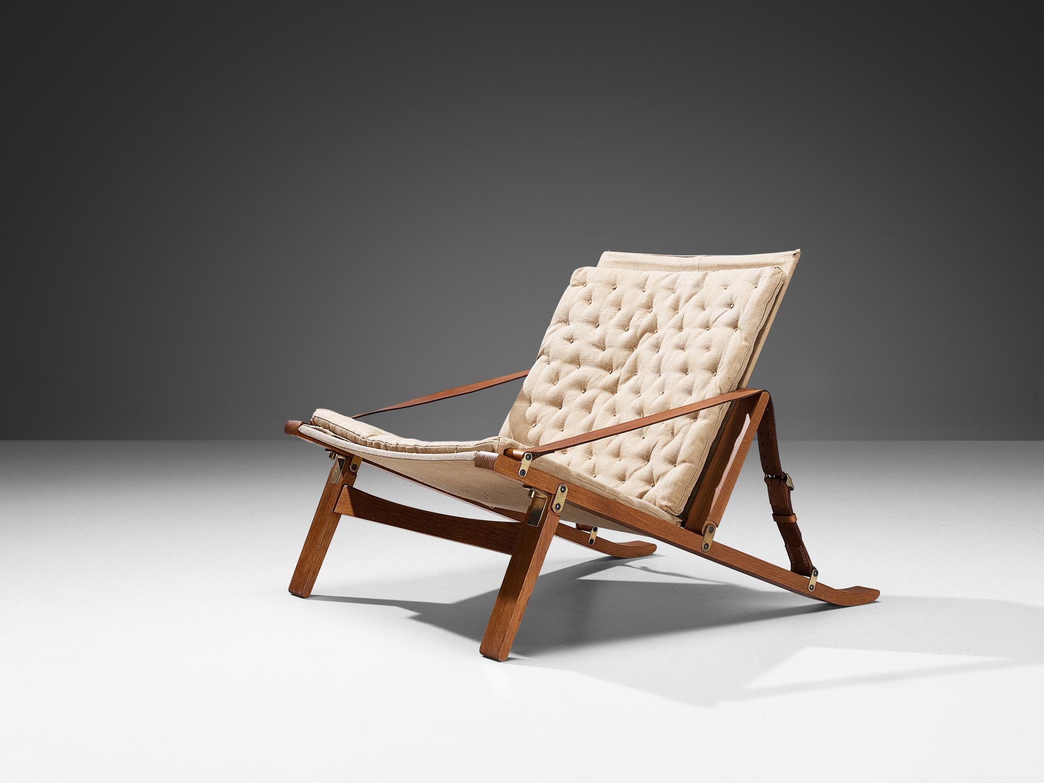 Jørgen Kastholm & Preben Fabricius for Poul Bachmann, folding lounge chair, model ‘PB10’, oak, leather, canvas, brass, steel, rope, Denmark, 1963. 

Crafted in 1963 by the skilled cabinetmaker Poul Bachmann, this folding easy chair bears the design