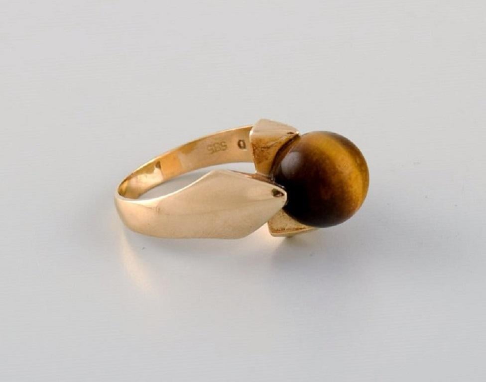 Jørgen Larsen:: dänischer Juwelier. Kopenhagen 1945-88. Vintage-Ring aus 14-karätigem Gold:: verziert mit einem Tigerauge. 
Durchmesser: 17 mm. 
US-Größe: 6.5. 
In ausgezeichnetem Zustand. 
Gestempelt. 
In den meisten Fällen können wir die Größe