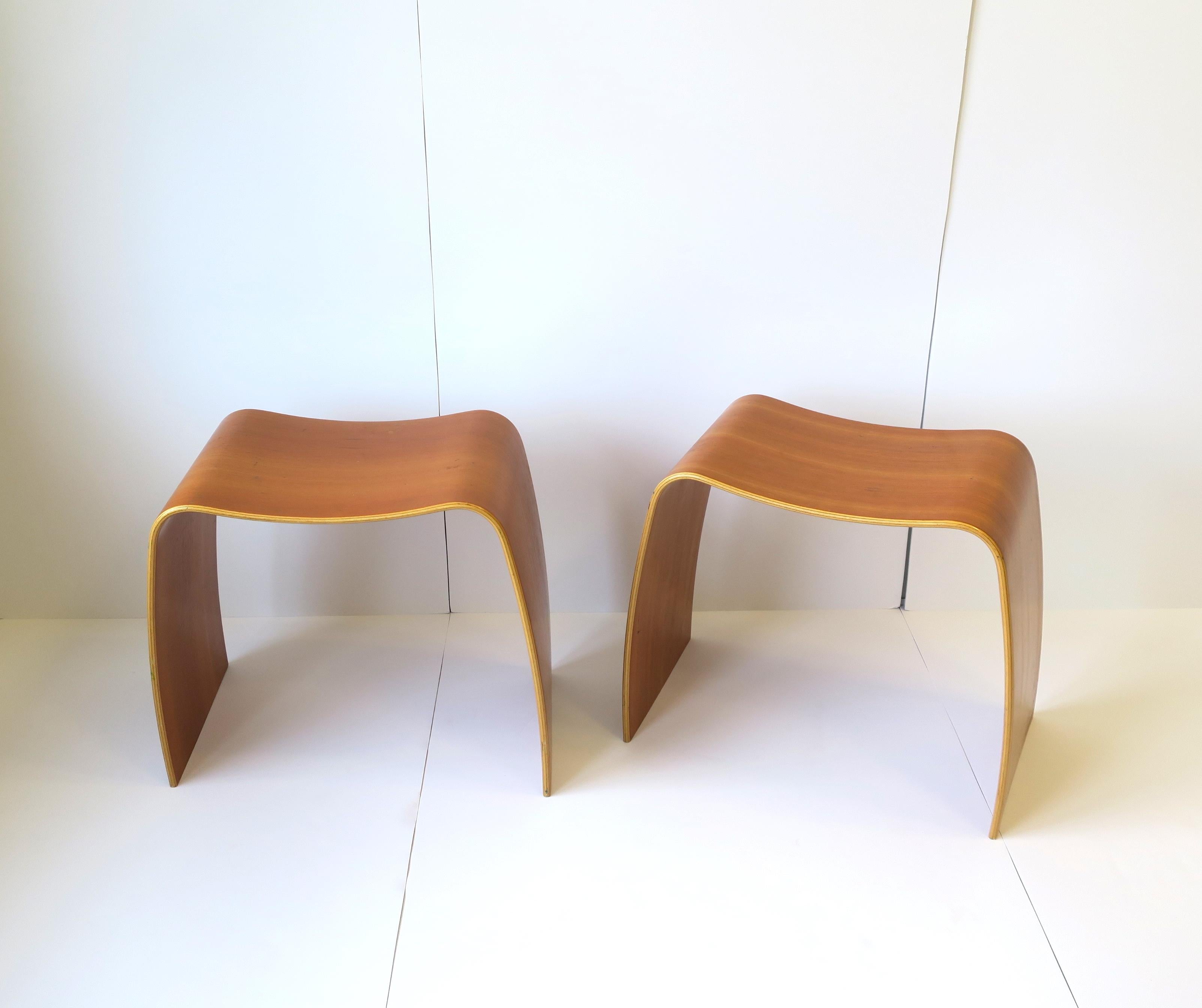A pair of Jørgen Møller M-Stool's. A pair of contemporary modern Minimalist cherry wood seating benches or stools designed by Danish designer Jørgen Møller, 20th century, carried by Danish furniture company Askman, Denmark, circa early-21st century,