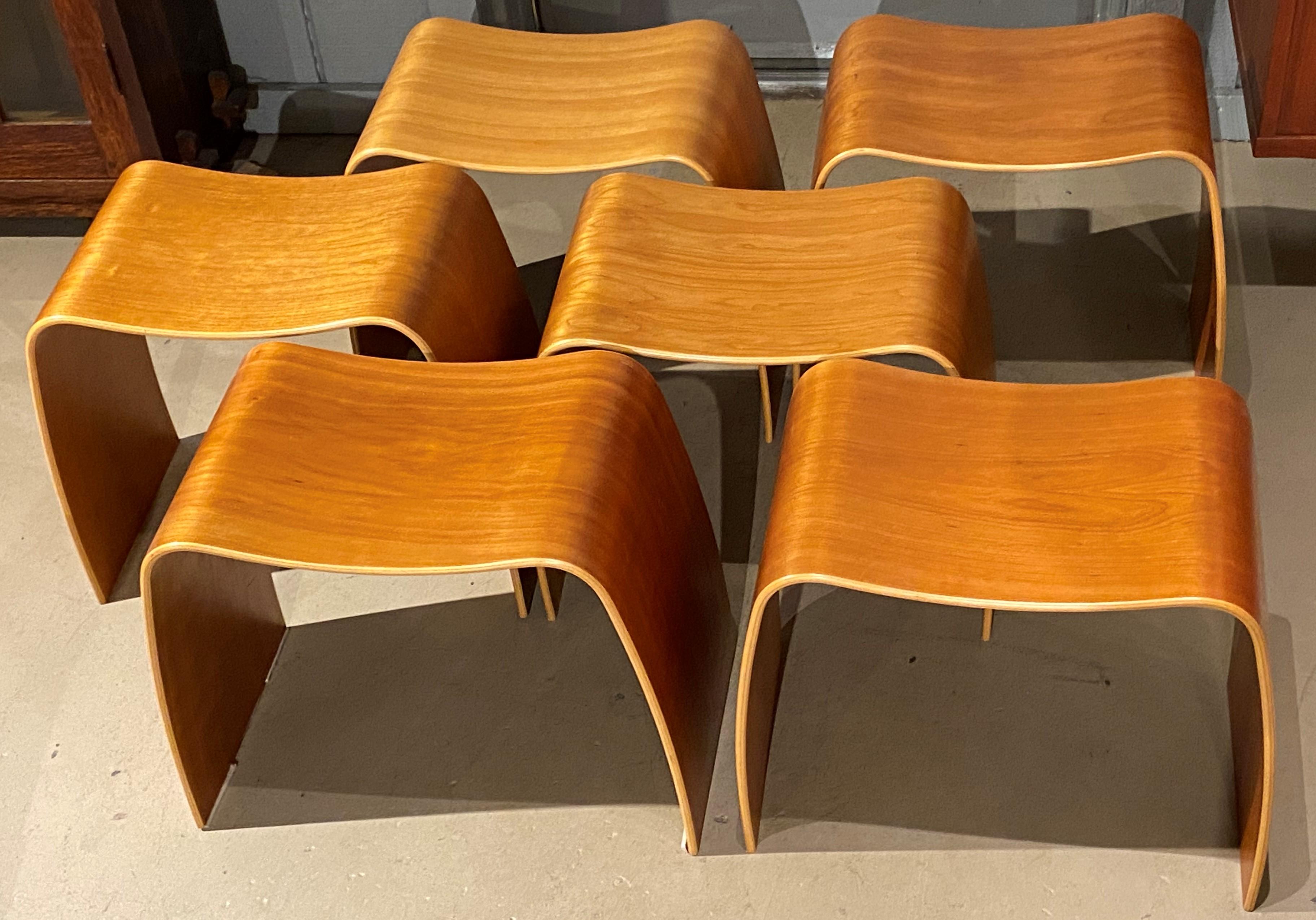 A fine set of six Danish Modern cherry veneer bentwood stacking Taburet M stools designed by Jørgen Møller (1930-2009) for Askman Wood & Furniture, with labels found on the underside of the stools. The set dates to the late 20th century and is in