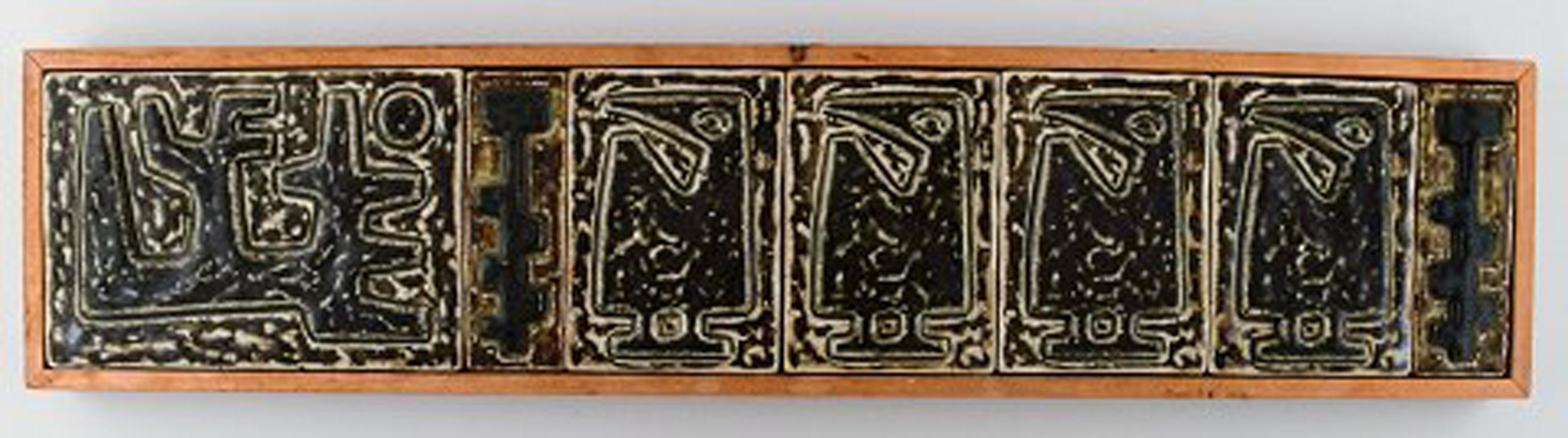 Jørgen Mogensen for Royal Copenhagen. Large wall plaque in the form of seven reliefs decorated with abstract motifs, 1970s.
Measures: 69.5 cm x 15.5 cm.
In perfect condition.