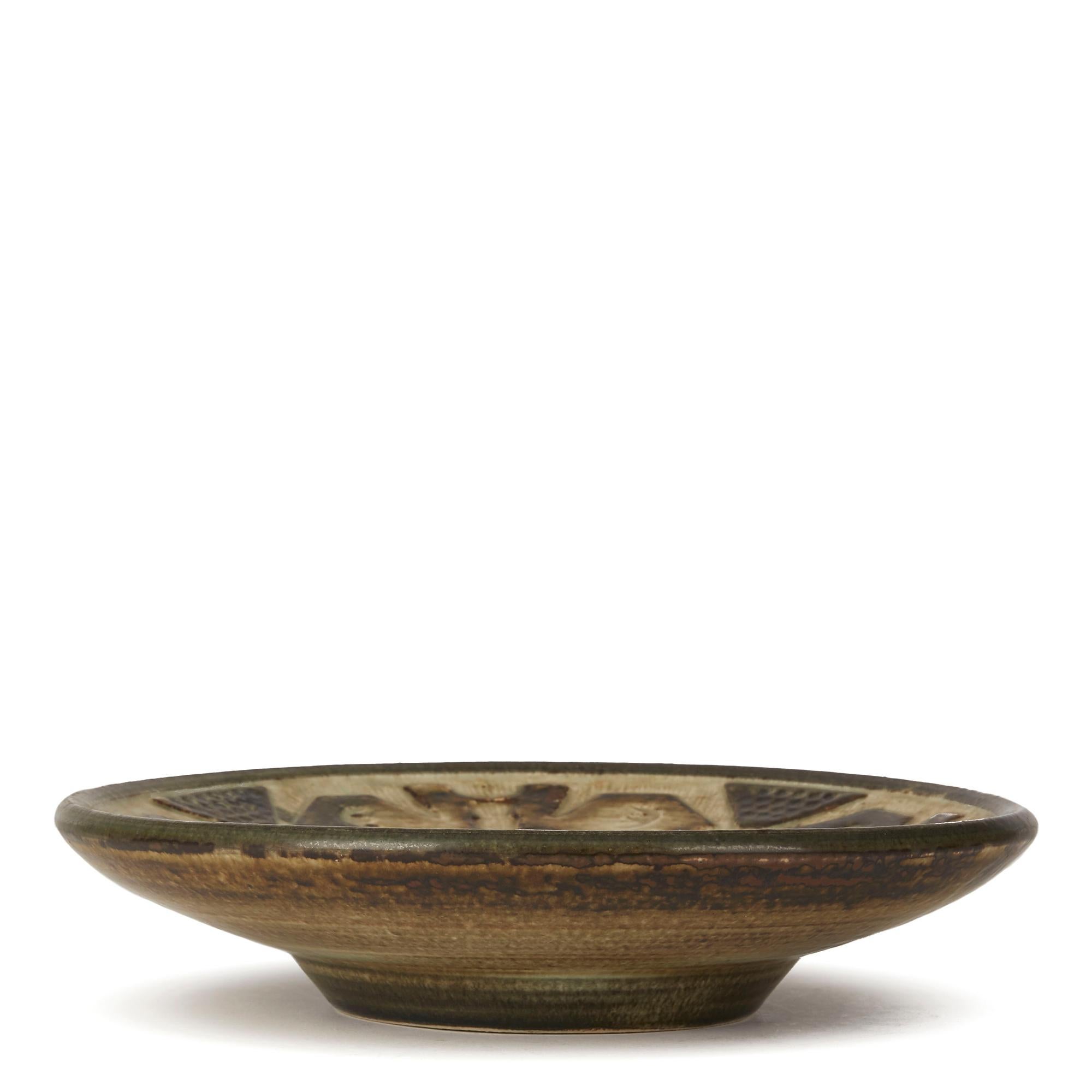 Stunning and heavily made midcentury Danish art pottery bowl designed by Jørgen Morgensen for Royal Copenhagen. Jørgen Morgensen is considered one of the most important potters and sculptors of the 20th century and this very stylish bowl has a