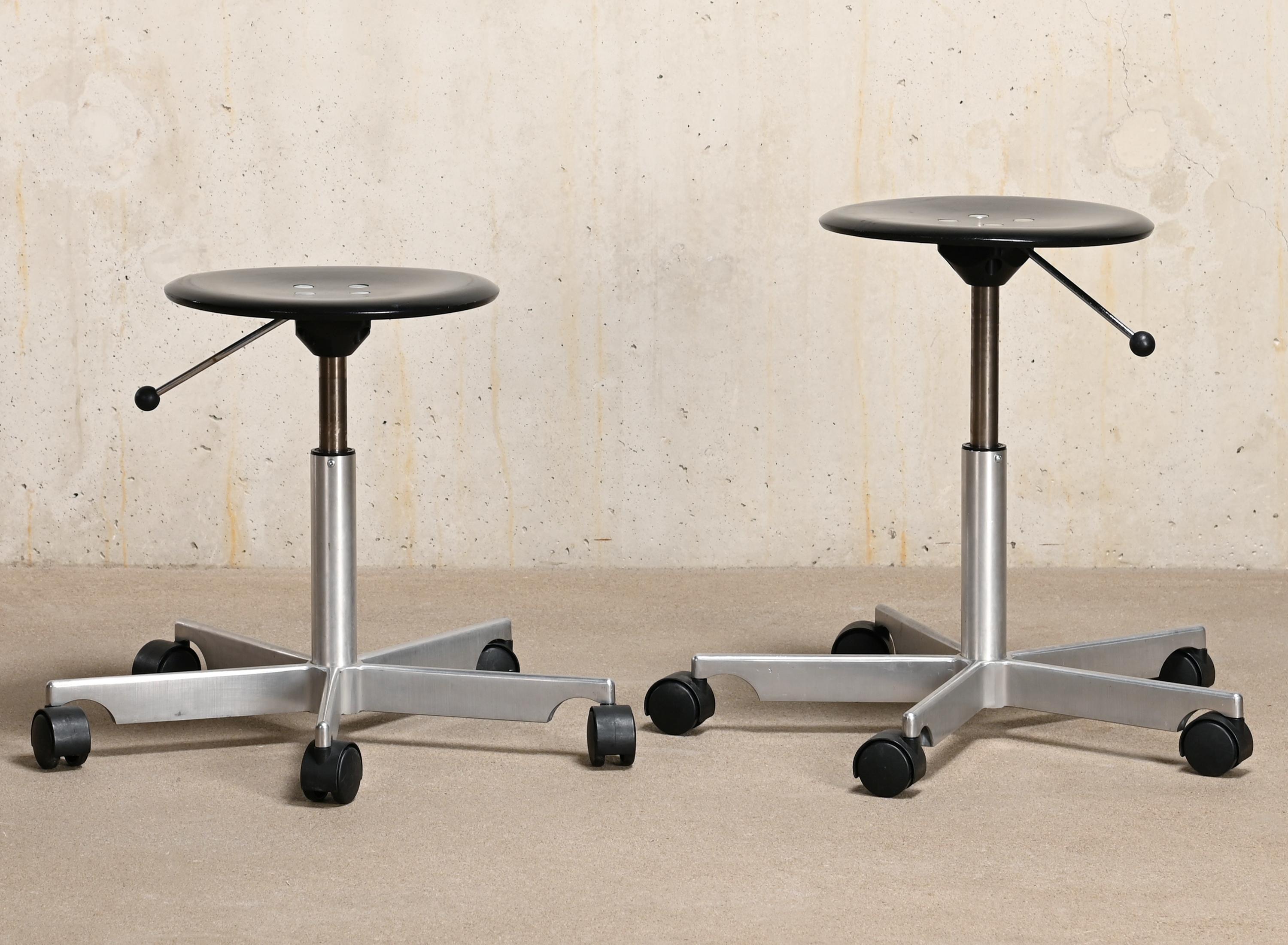 Light weight aluminum swivel stools designed by Jørgen Rasmussen for Fritz Hansen Denmark. Five star polished aluminum foot with black stained ash plywood seats and pneumatic height adjustment. Very good original condition with only light wear.