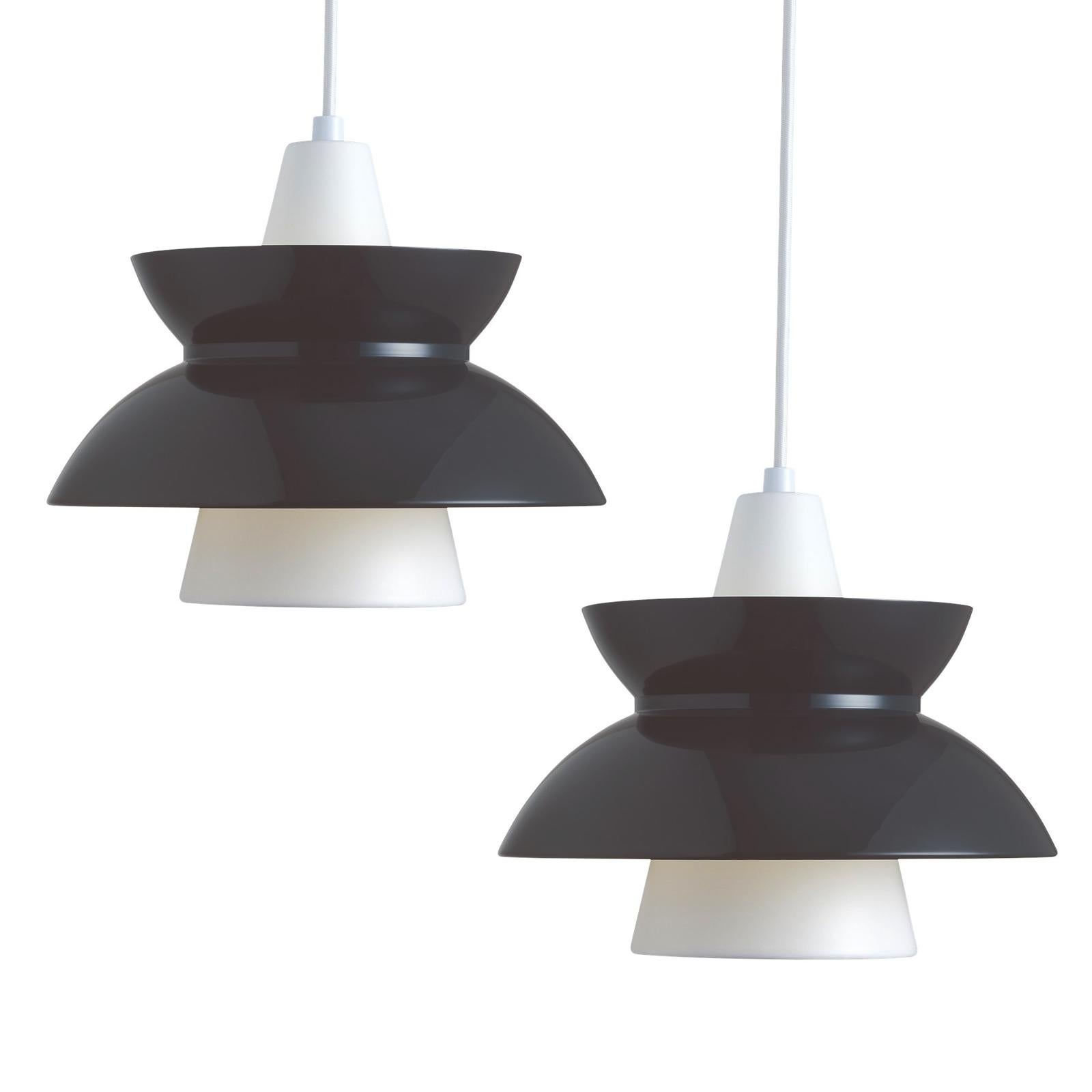 Jørn Utzon 'Doo-Wop' pendant for Louis Poulsen in dark gray. Designed in the 1950s and re-editioned in 2016. Available in both white and dark gray. 

Price is per item. 

Originally introduced in the 1950s, the Doo-Wop pendant light was designed