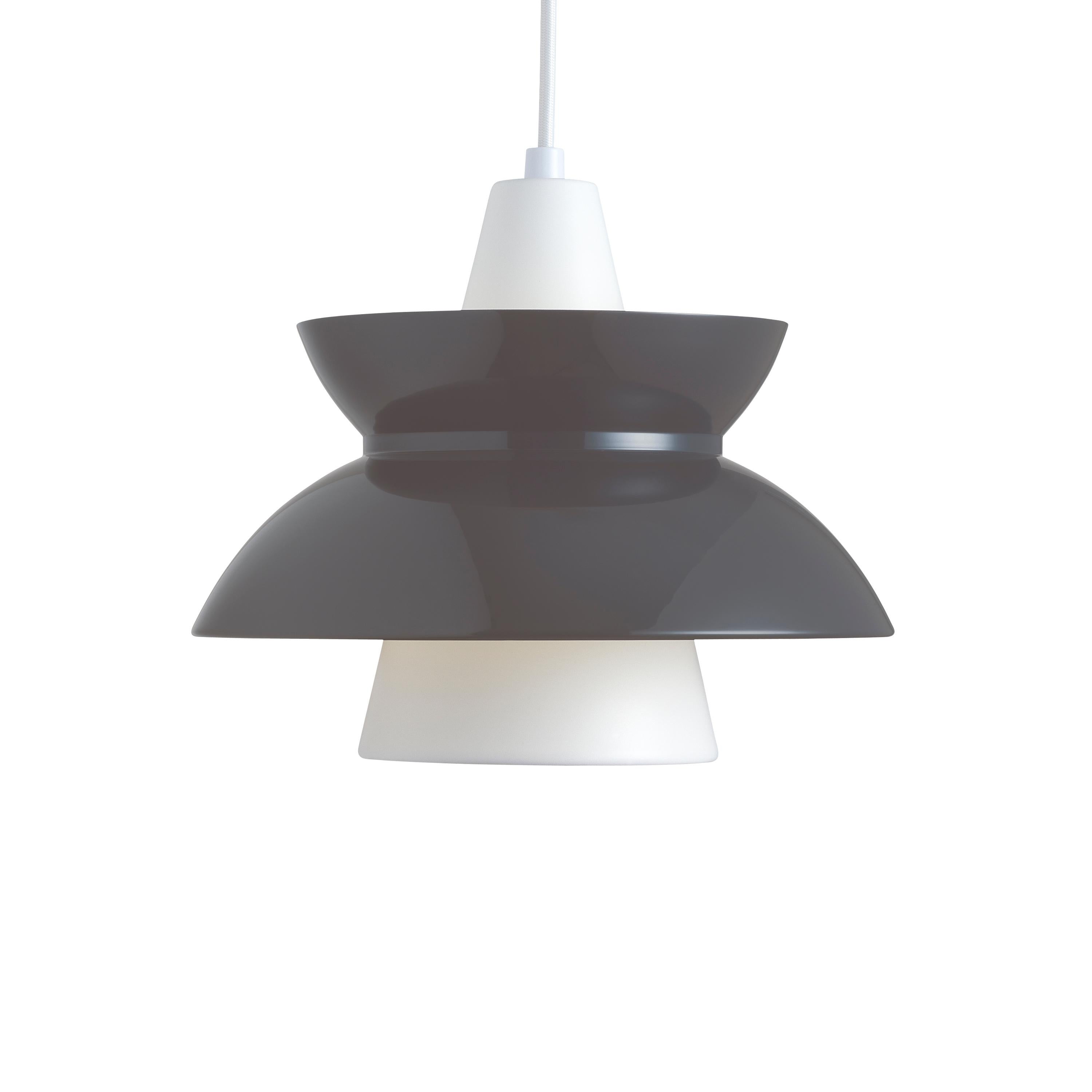 Jørn Utzon 'Doo-Wop' pendants for Louis Poulsen. Designed in the 1950s and re-editioned in 2016. Available in white and dark gray. 

Price is per item. 

Originally introduced in the 1950s, the Doo-Wop pendant light was designed in close cooperation