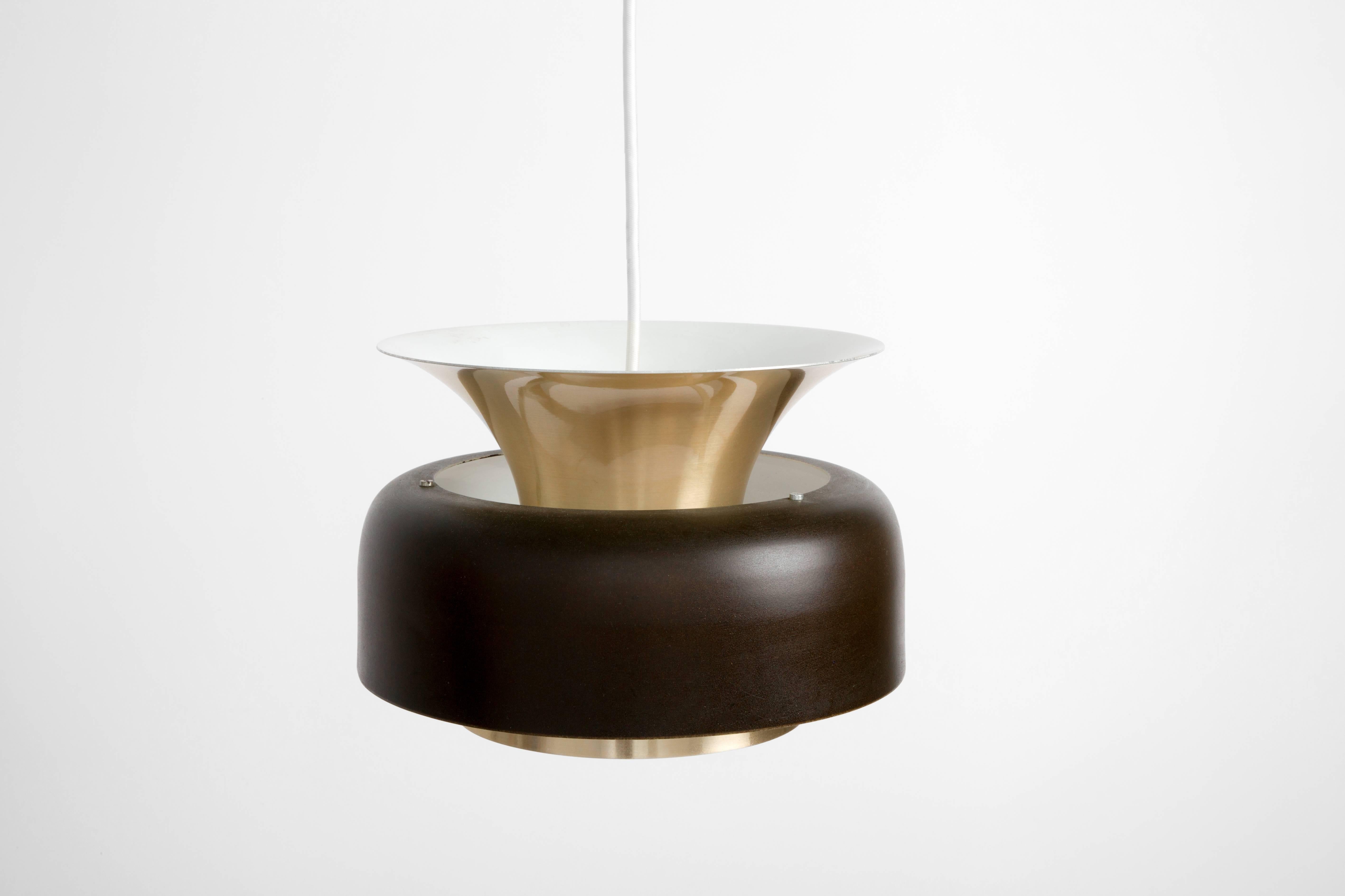 This pendant is made of brass and black and white enamel. Rewired to US standards.