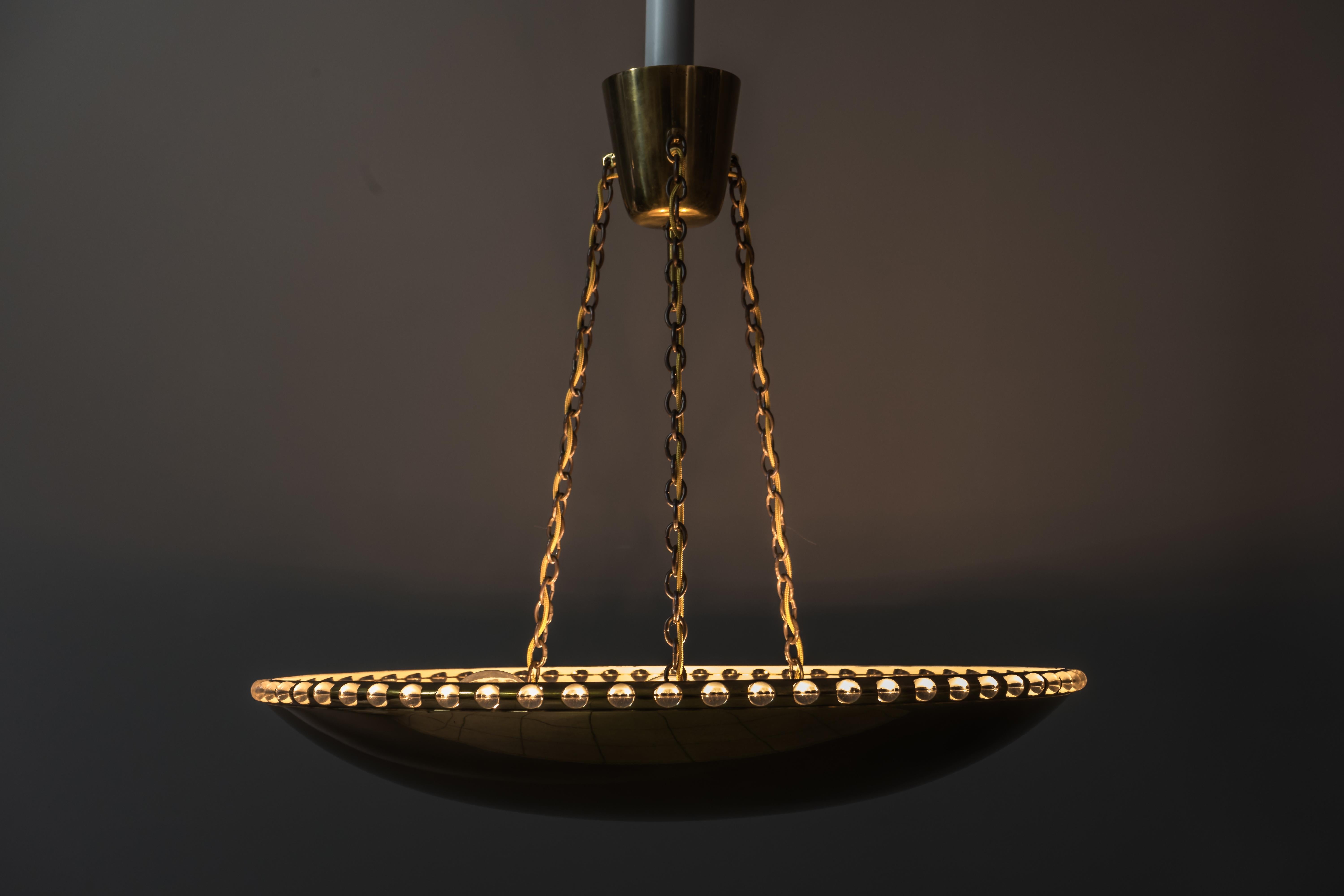 J.T. Kalmar brass and crystal uplight chandelier, circa 1950
Original condition.
