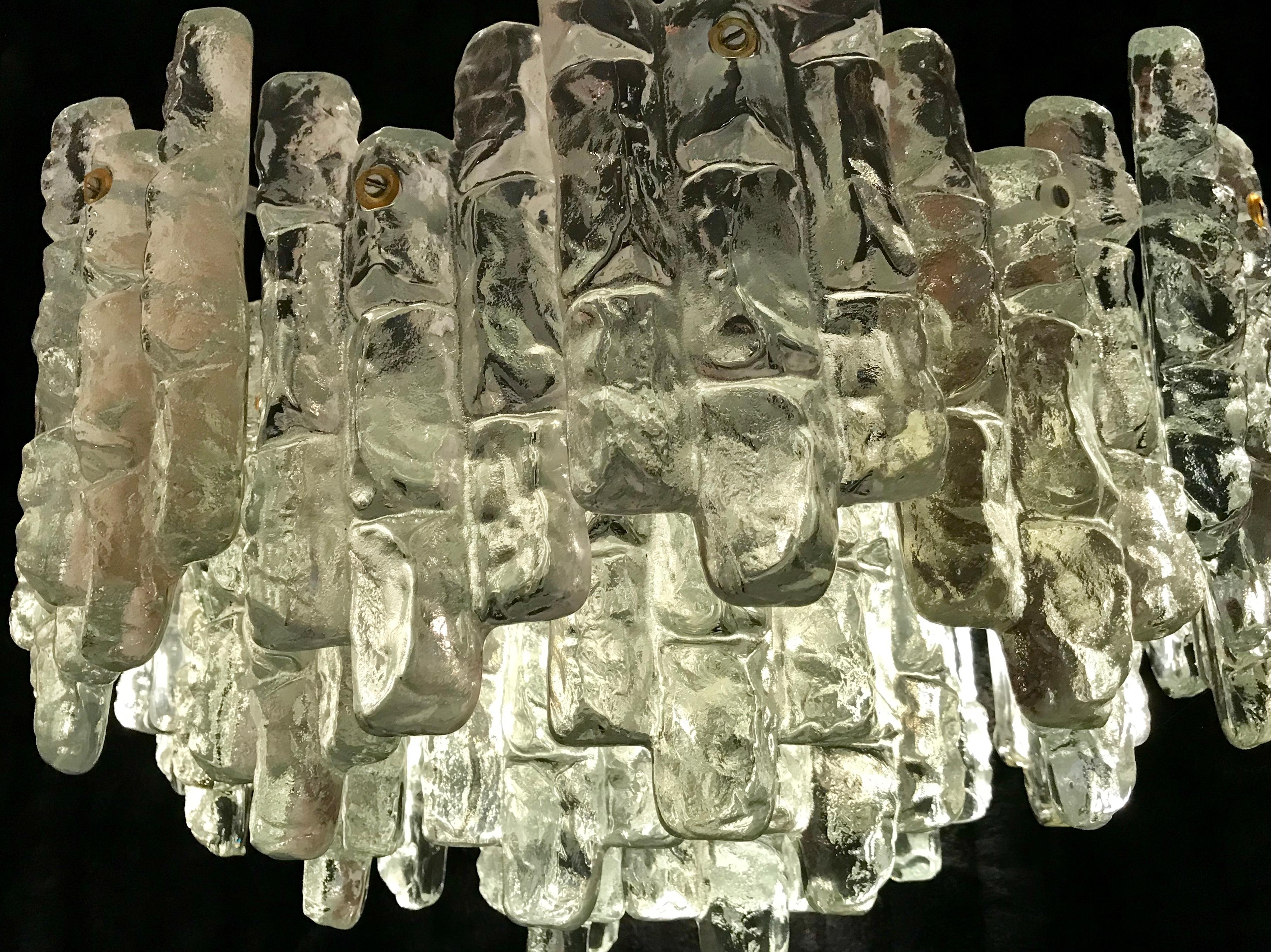 Superbe JT Kalmar chandelier ice frost glass with chrome metal structure. The Design and the quality of the glass make this piece the best of the Austrian Design.

This Pieces of Arts glass show the exclusive design of Austrian Designer in 1970.
