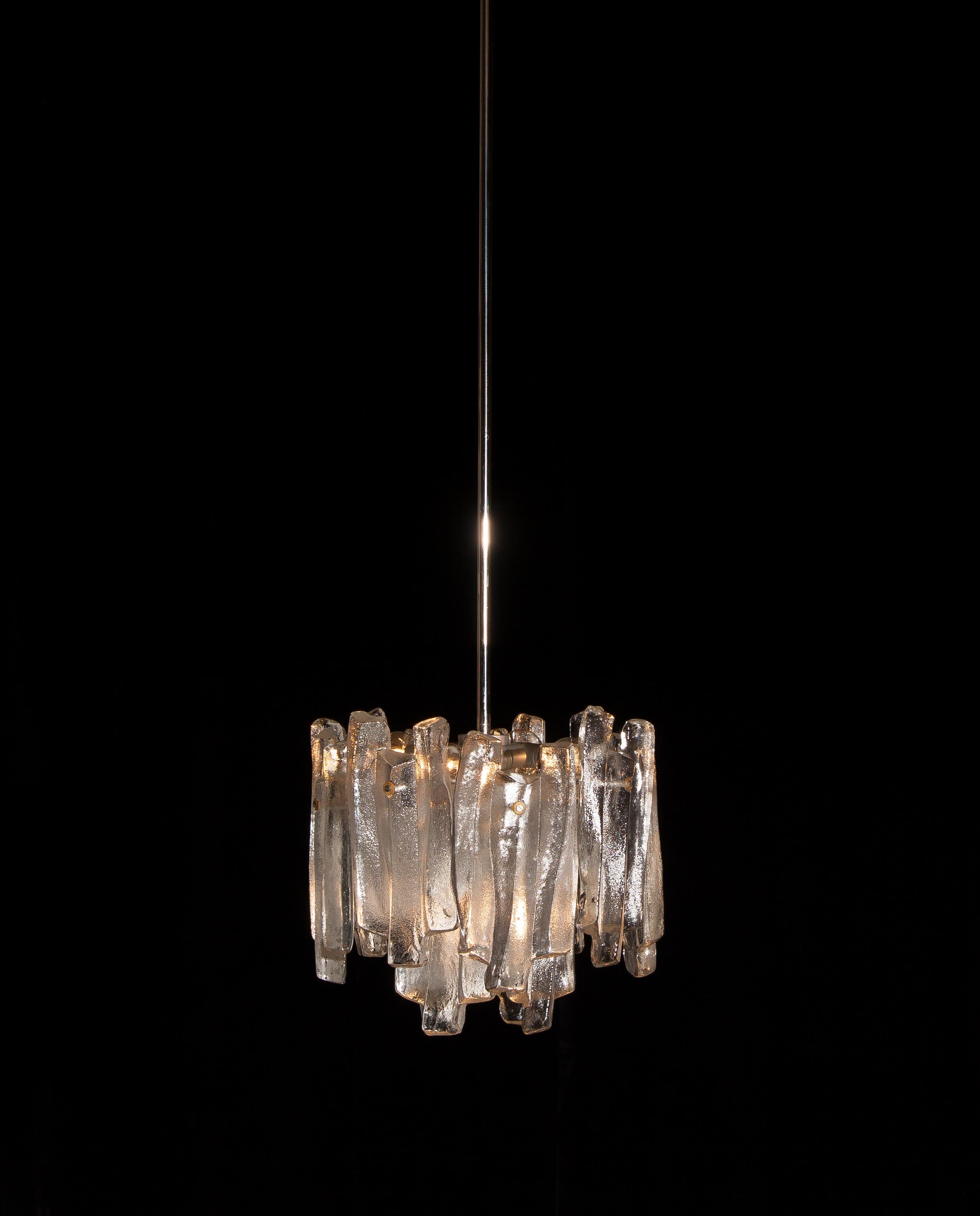 Beautiful J.T. Kalmar design chandelier with twelve frosted massive glass elements all in perfect condition.
The diameter of the lamp circa 36 cm/14 inch. Total height circa 130 cm / 51 inch.
Technically 100%, overall for four bulbs E14 / 17 and