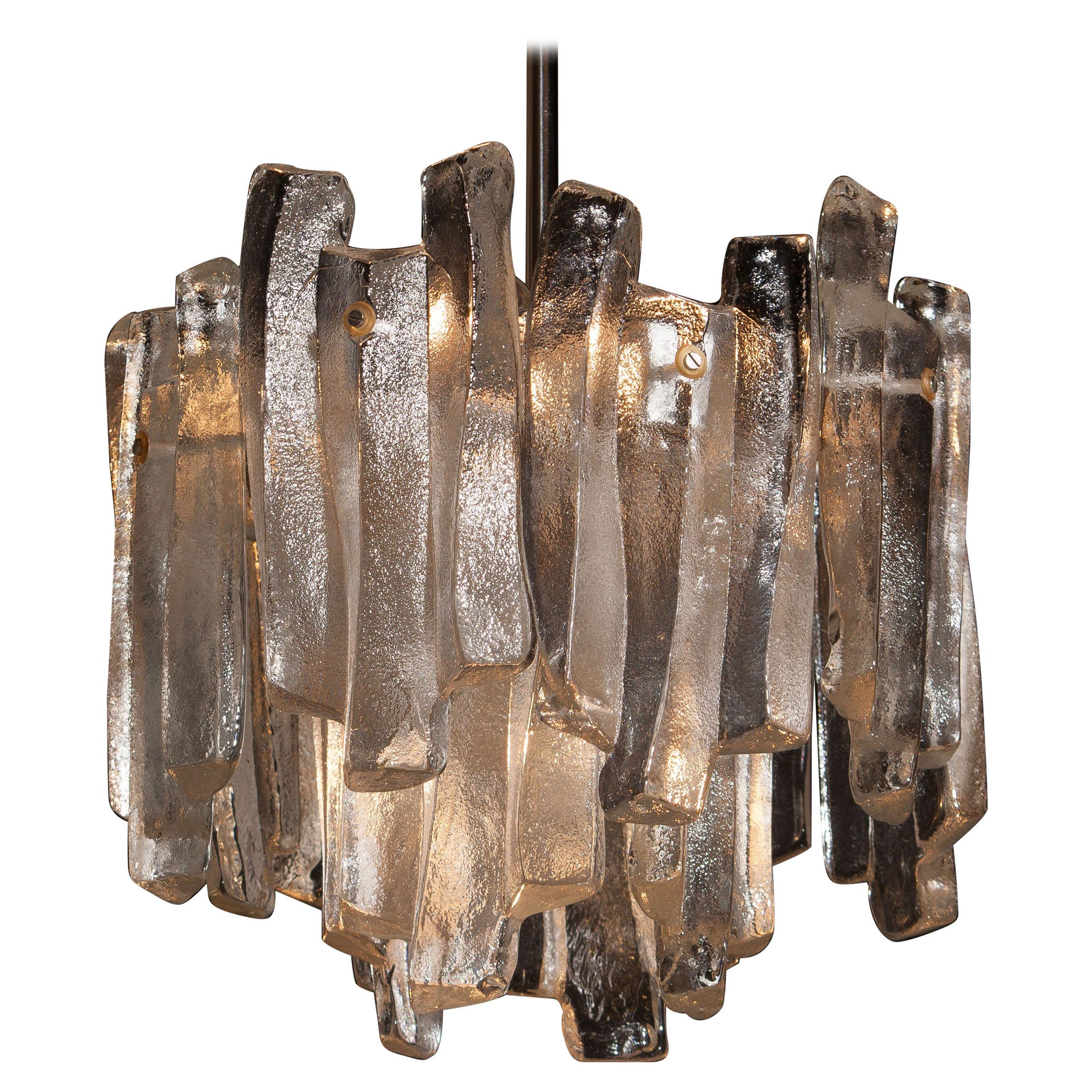 Beautiful J.T. Kalmar design chandelier with twelve frosted massive glass elements all in perfect condition.
The diameter of the lamp circa 36 cm/14 inch. Total height circa 130 cm / 51 inch.
Technically 100%, overall for four bulbs E14 / 17 and