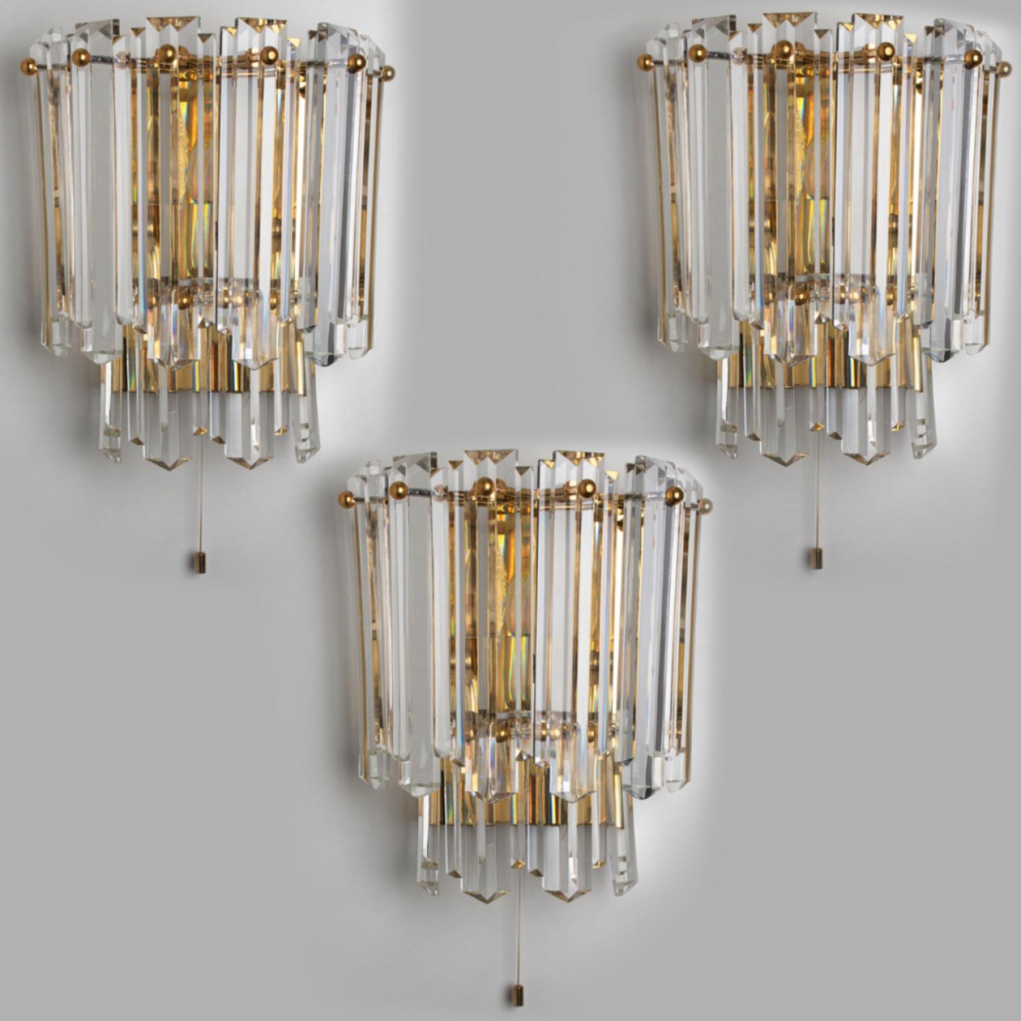 High-end wall sconce featuring wonderful faceted crystal clear glass 
