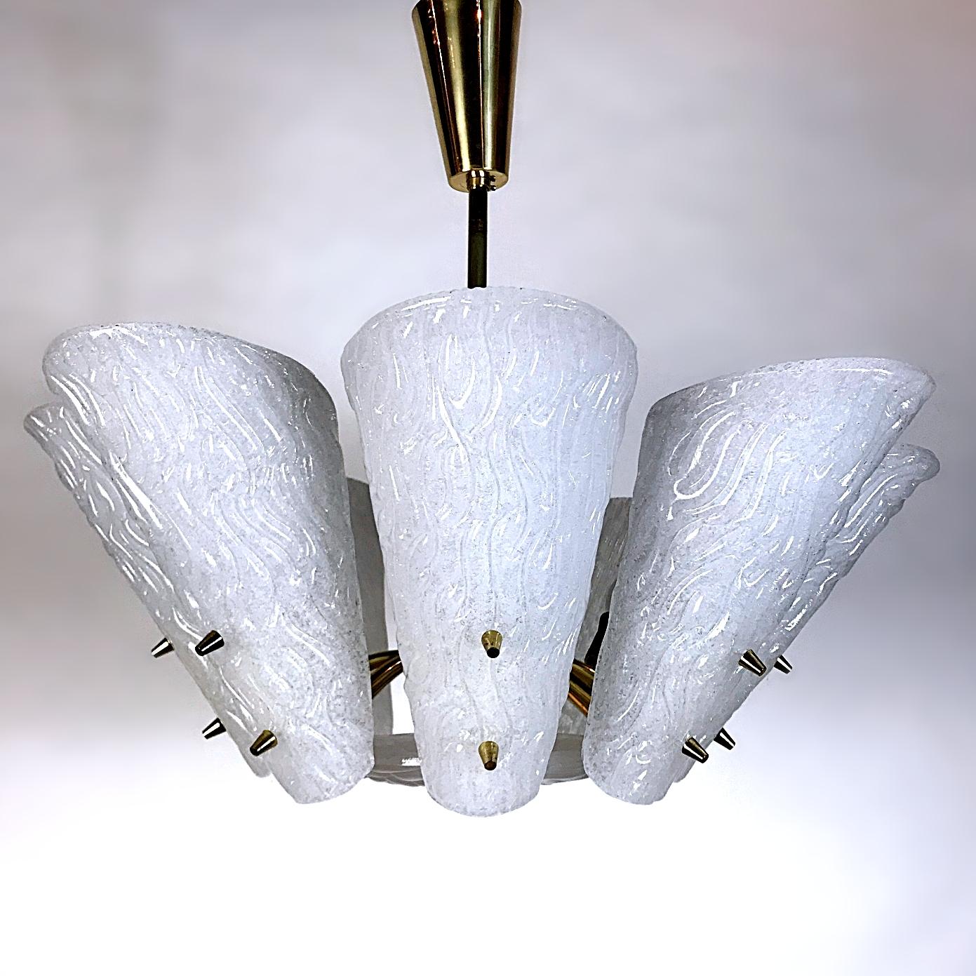 Beautiful Mid-Century Modern frosted milk glass chandelier manufactured by J.T. Kalmar, with the characteristic blown ice glass plates. This chandelier is a striking appearance in every room. Due to the sublime combination of glass and brass - this