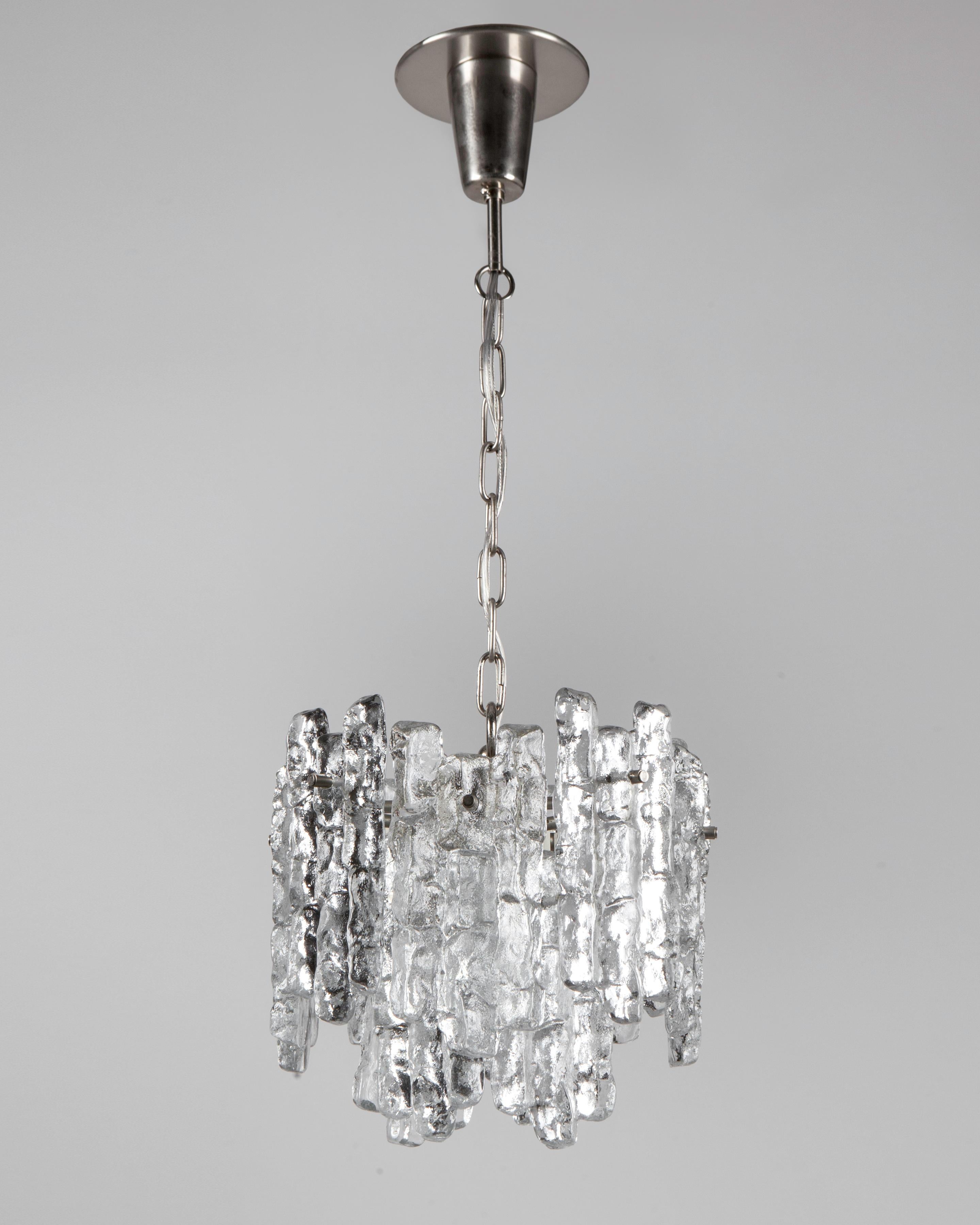 A vintage pendant with clear textured cast glass tiles on a nickel frame. Signed by the Austrian maker Kalmar. Due to the antique nature of this fixture, there may be some nicks or imperfections in the glass as well as variations from piece to